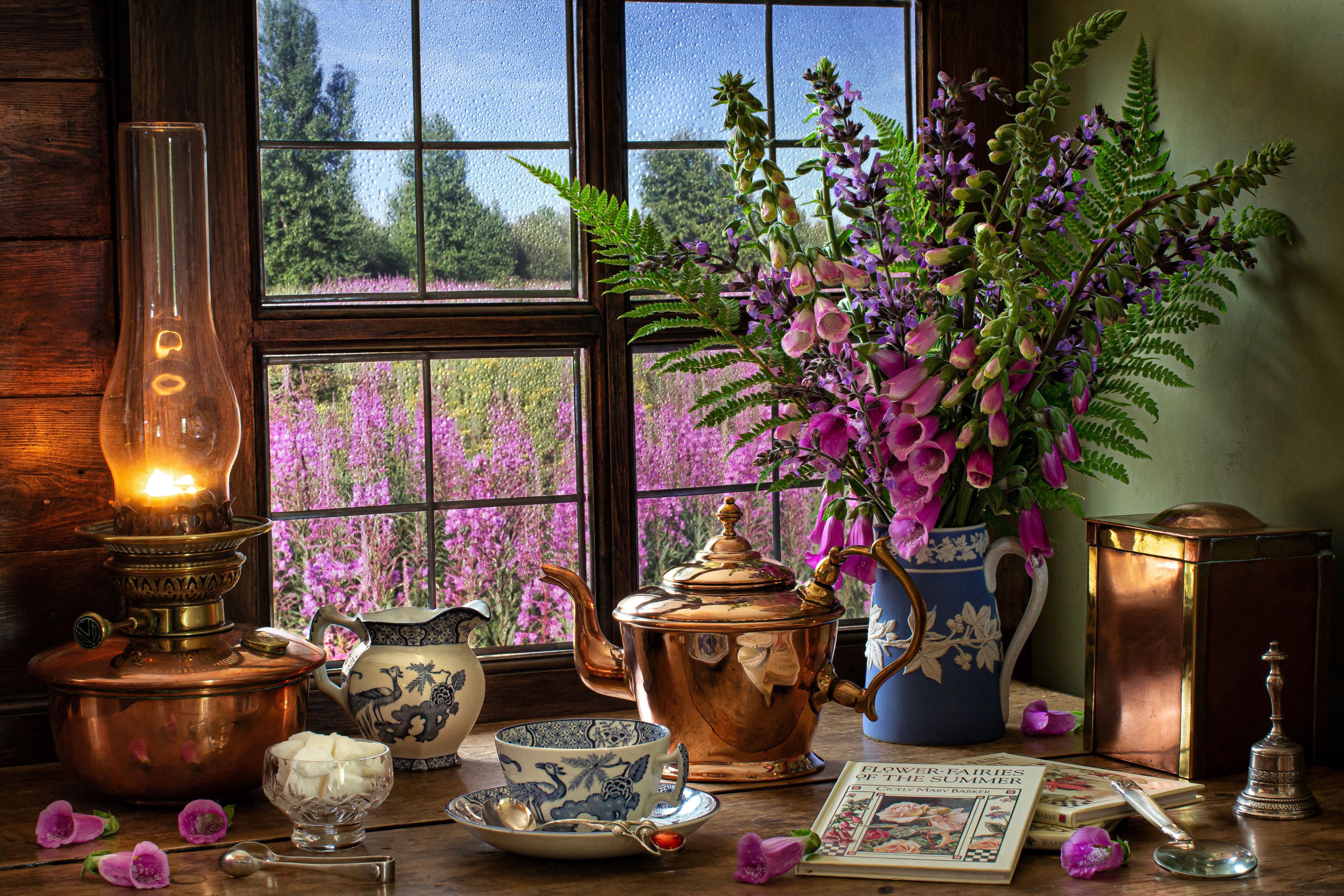 Still life with kerosene lamp, tea set, and flowers by the window HD Wallpaper