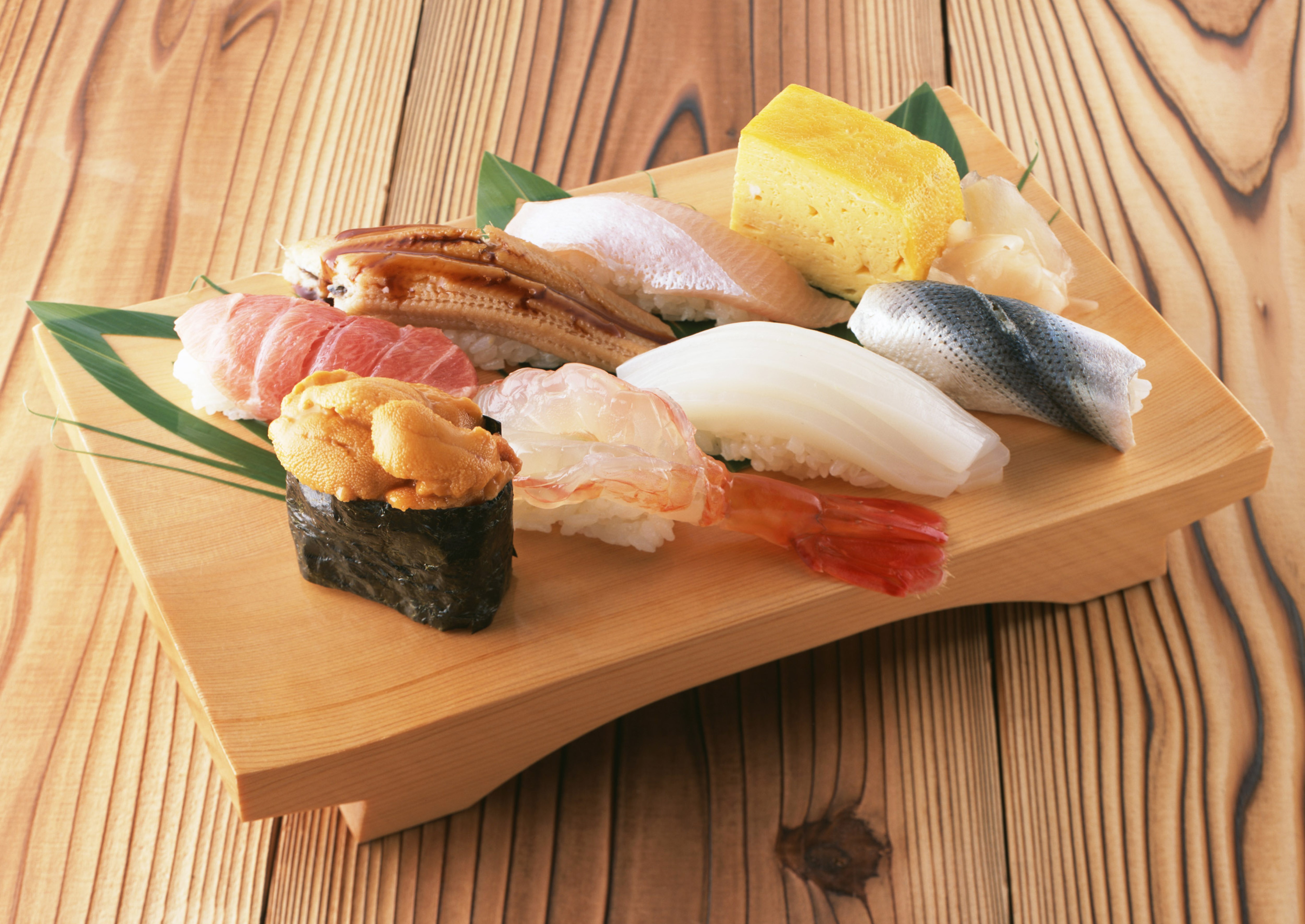 Sushi platter on wooden background HD Wallpaper