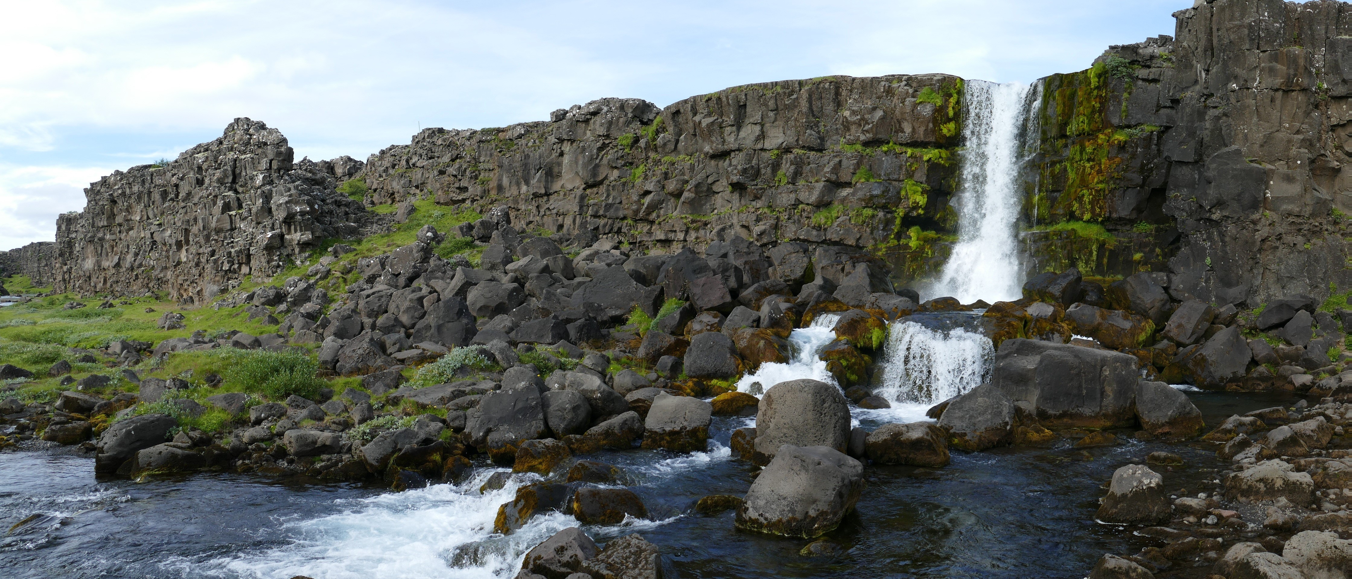 Waterfall and rocks in Thingvellir National Park, Iceland HD Wallpaper