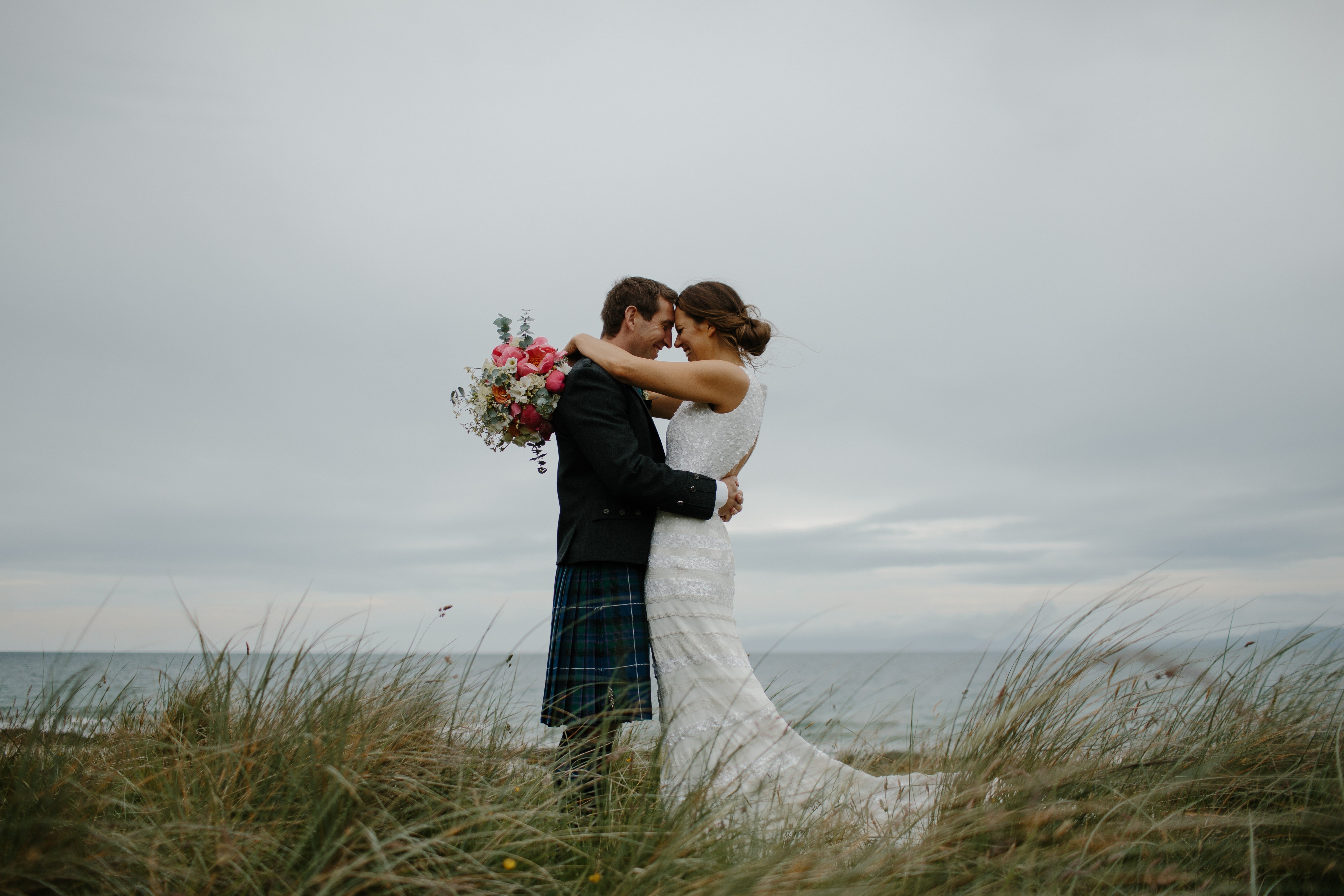 Bride and Groom in Kilt with Bouquet by the Sea HD Wallpaper