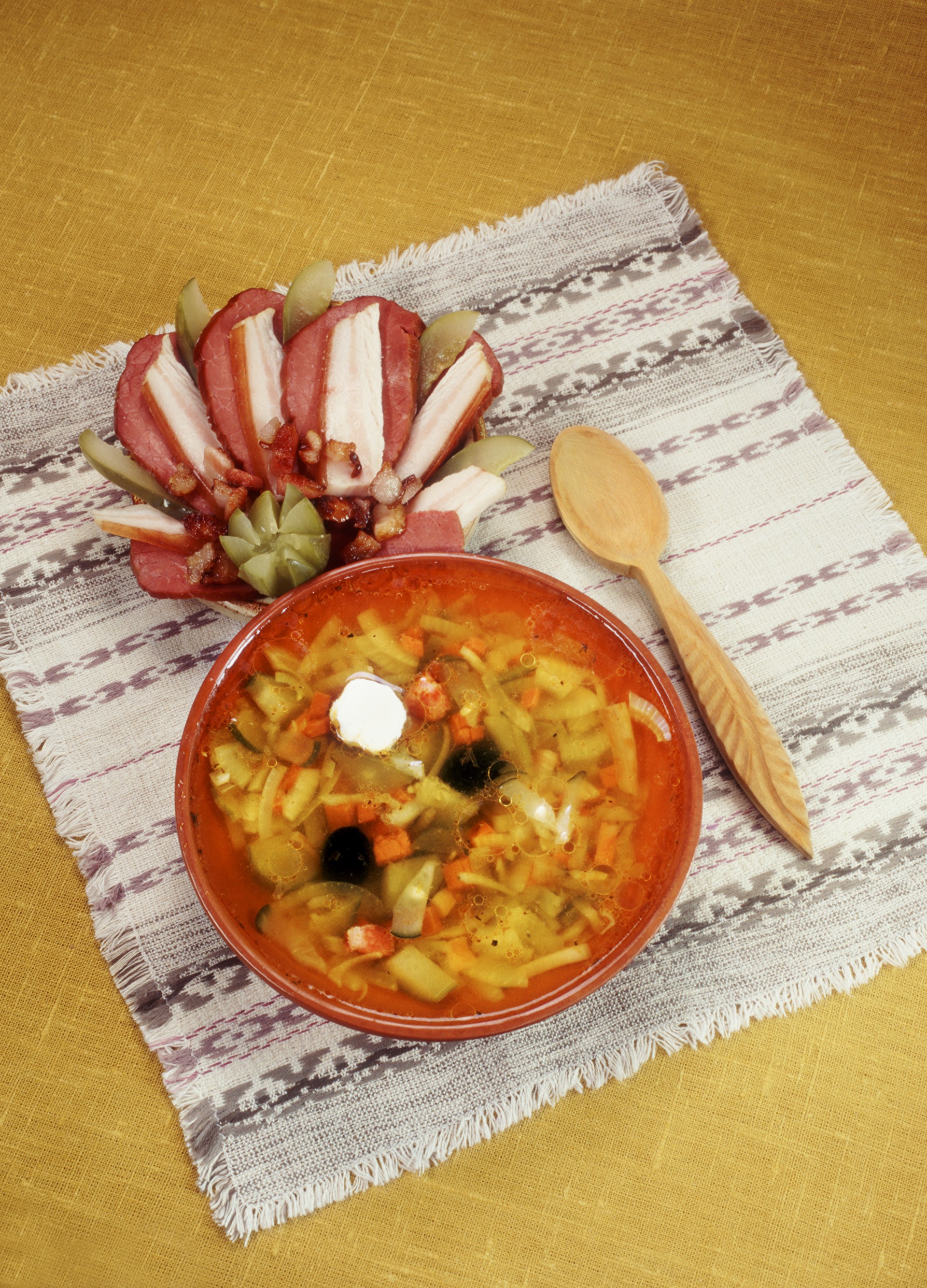 Soup and meat platter with spoon on tablecloth HD Phone Wallpaper