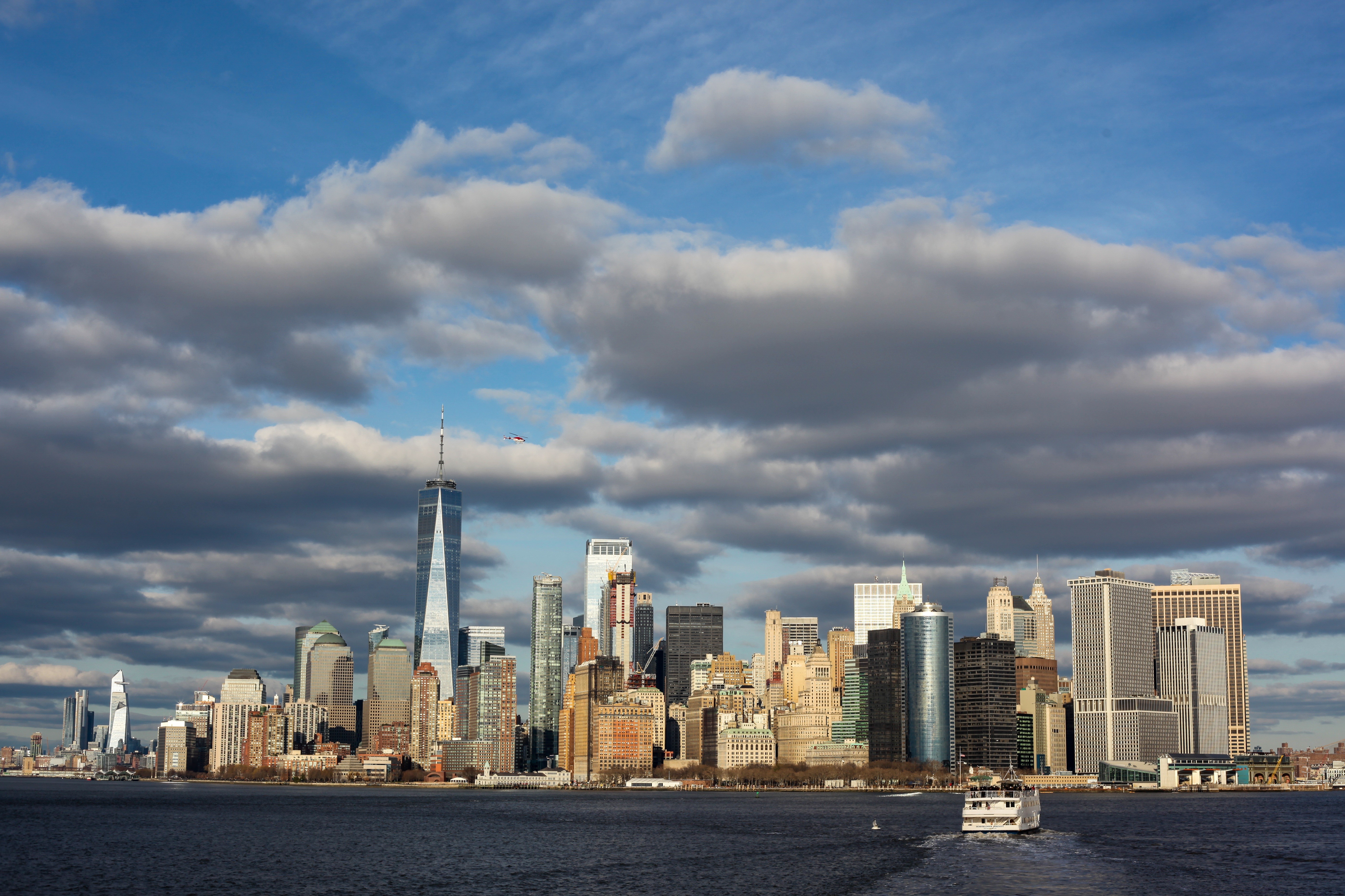 New York City skyline with One World Trade Center and motorboat HD Wallpaper