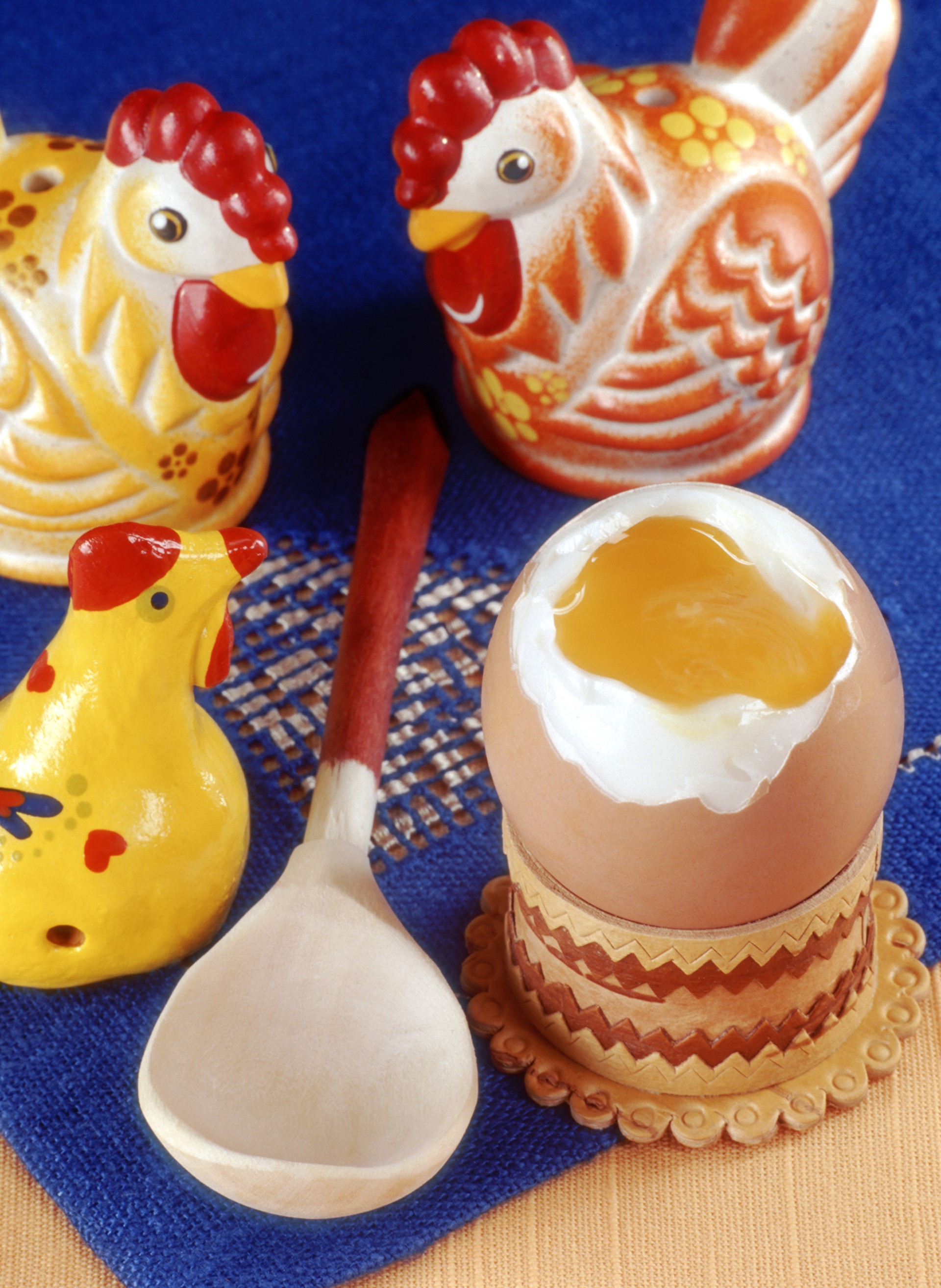 Chicken figurines and a soft-boiled egg with a spoon HD Phone Wallpaper