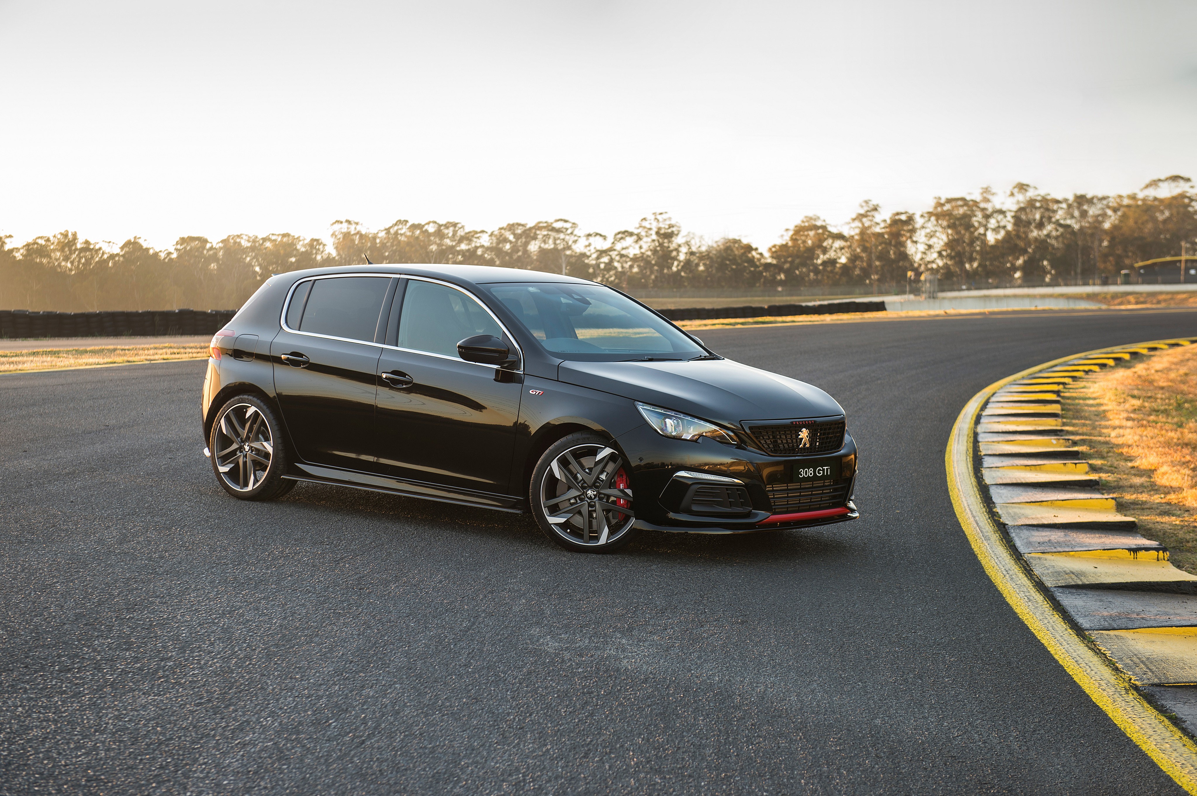 Black 2019 Peugeot 308 GTi Sport on a Racetrack HD Wallpaper