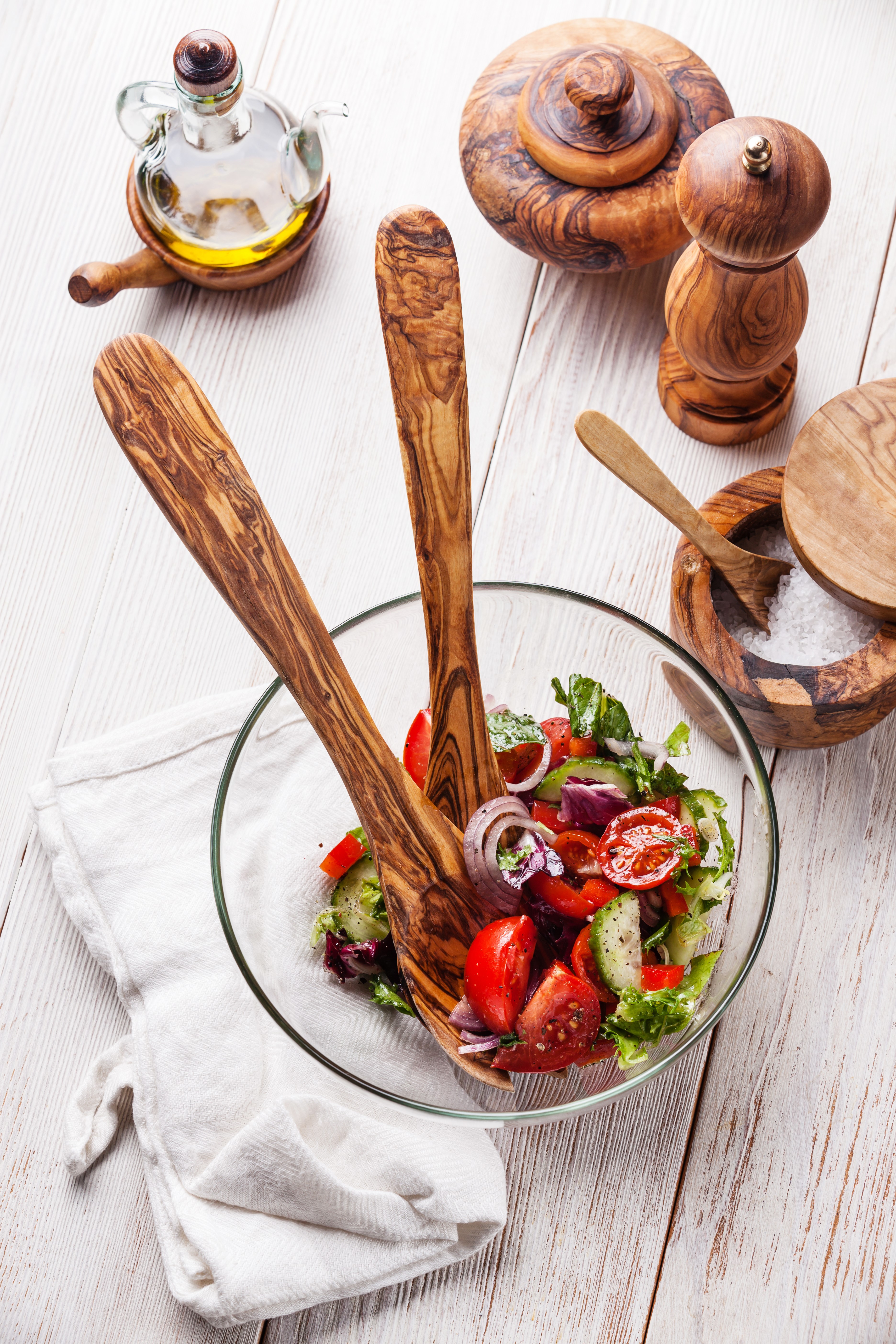 Salad with wooden utensils and olive oil HD Phone Wallpaper