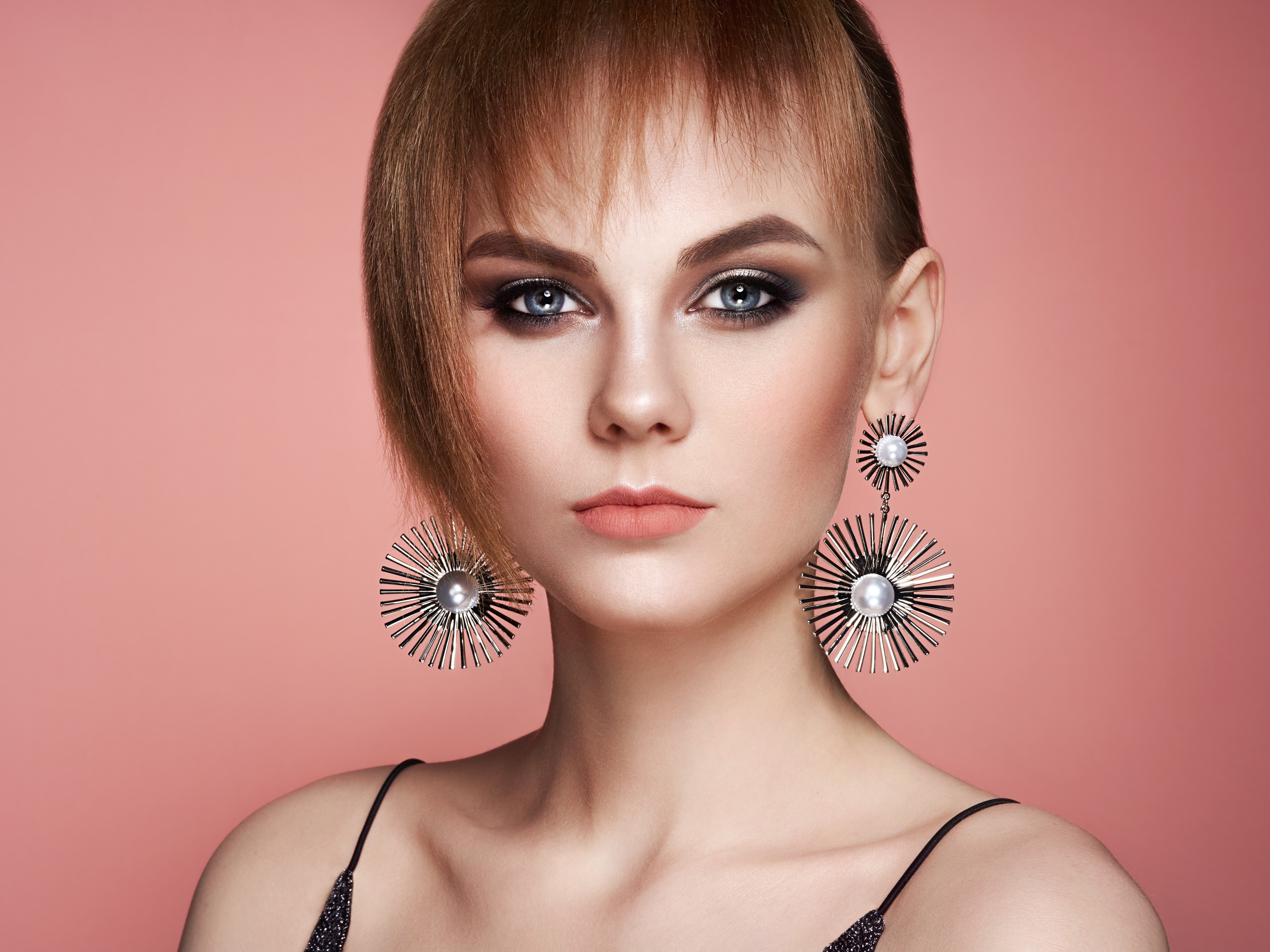 Woman with large earrings and dramatic makeup HD Wallpaper