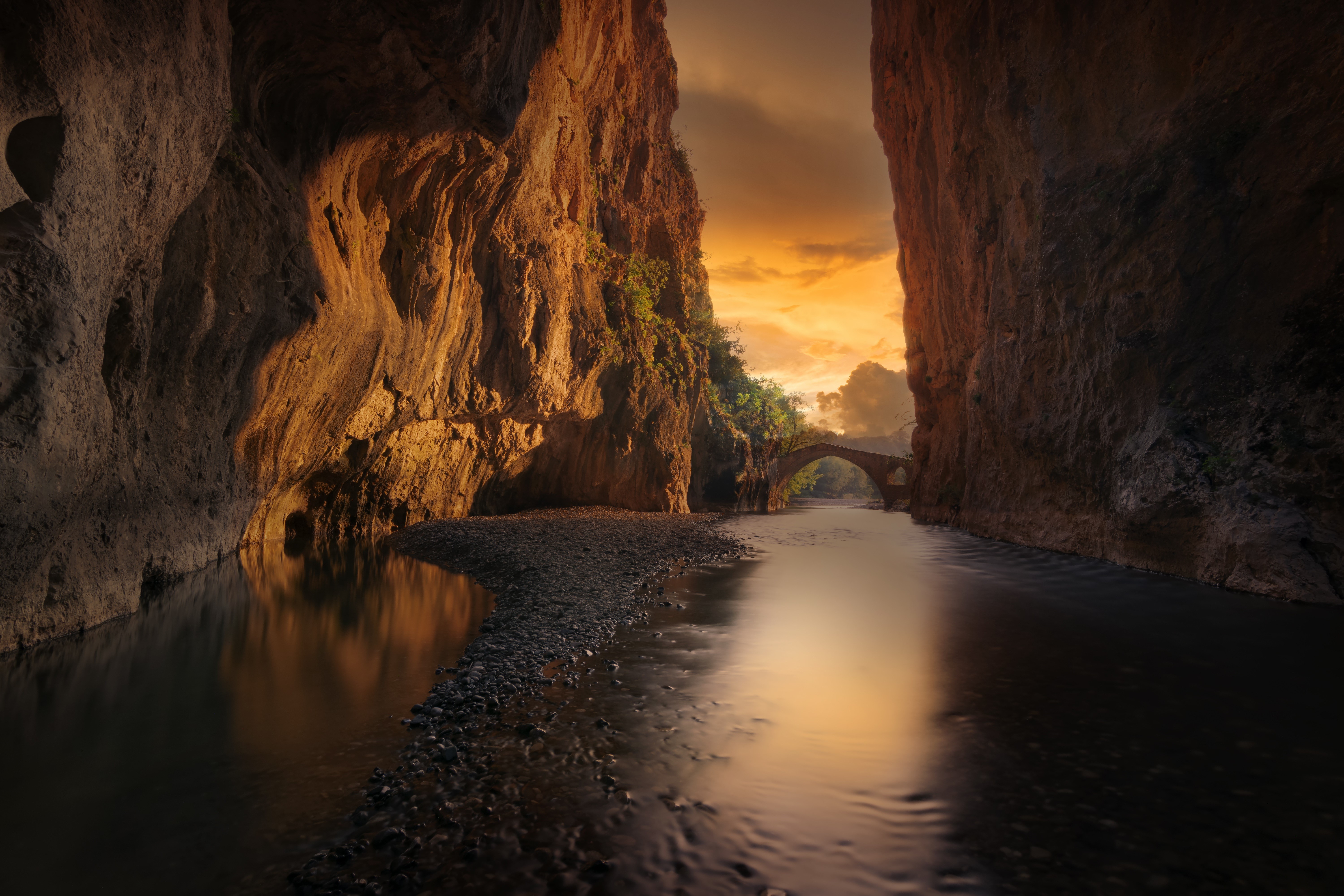 Canyon with river and ancient bridge at sunset HD Wallpaper