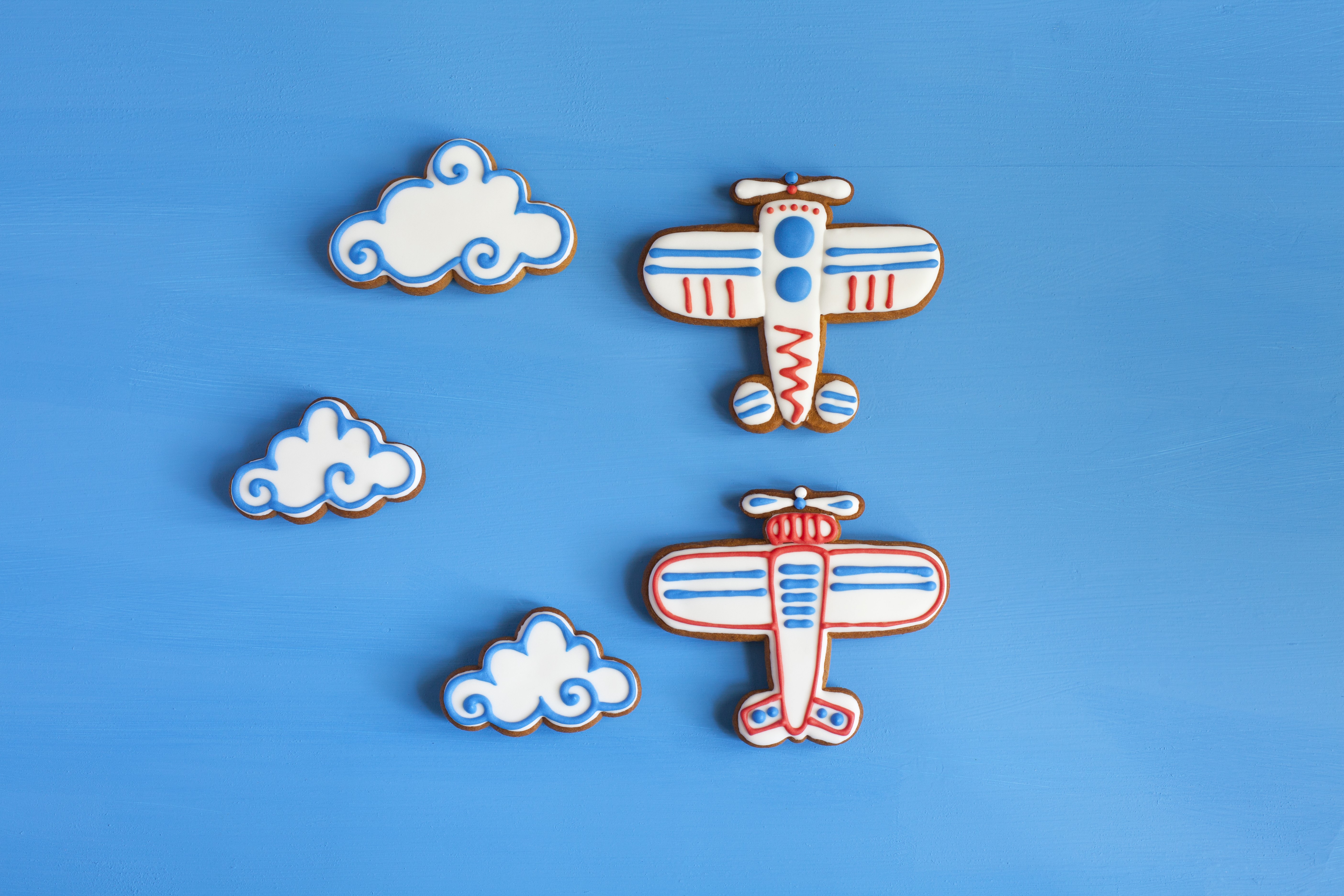 Airplane and Cloud Cookies on Blue Background HD Wallpaper