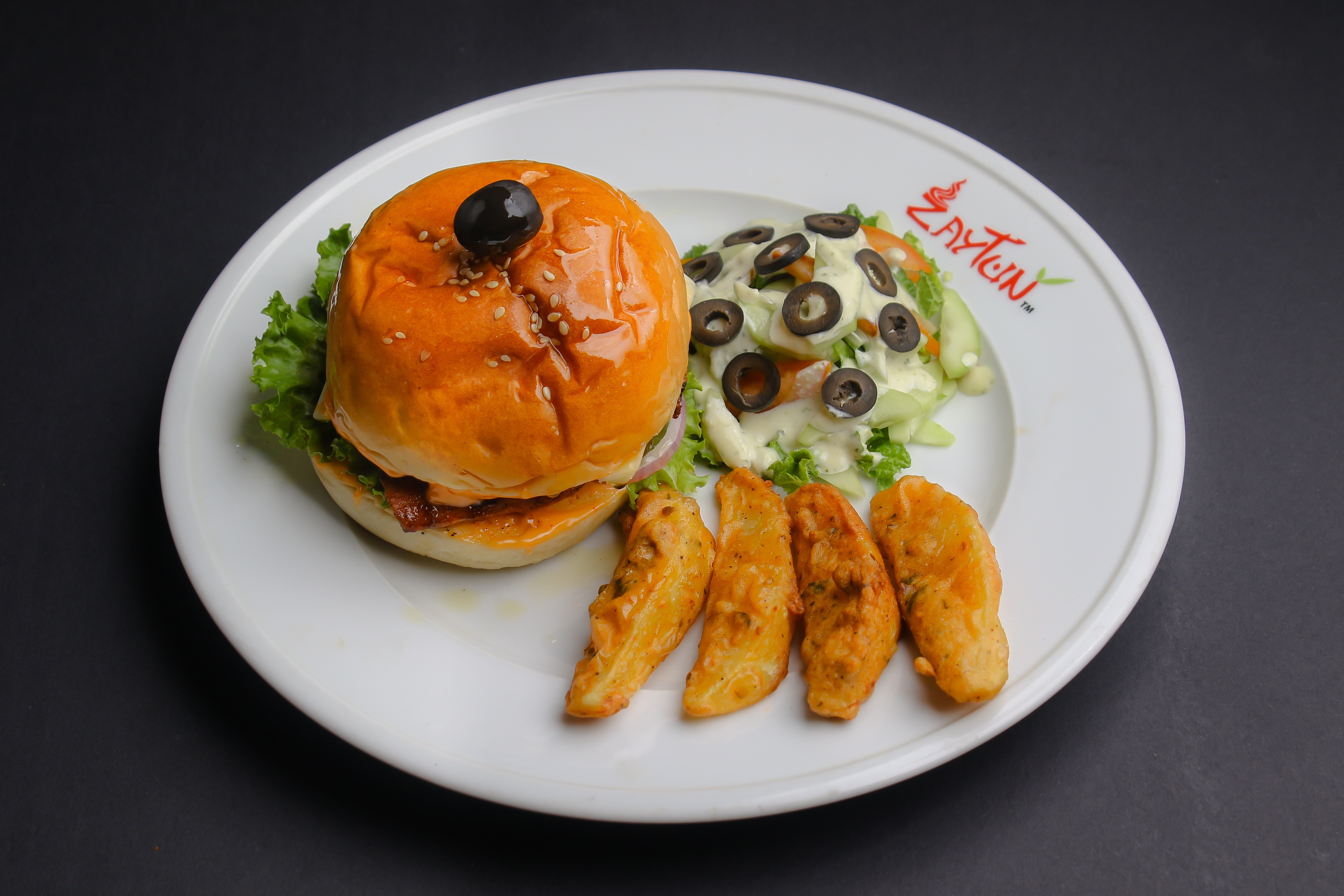 Hamburger with salad and potato wedges on a plate HD Wallpaper