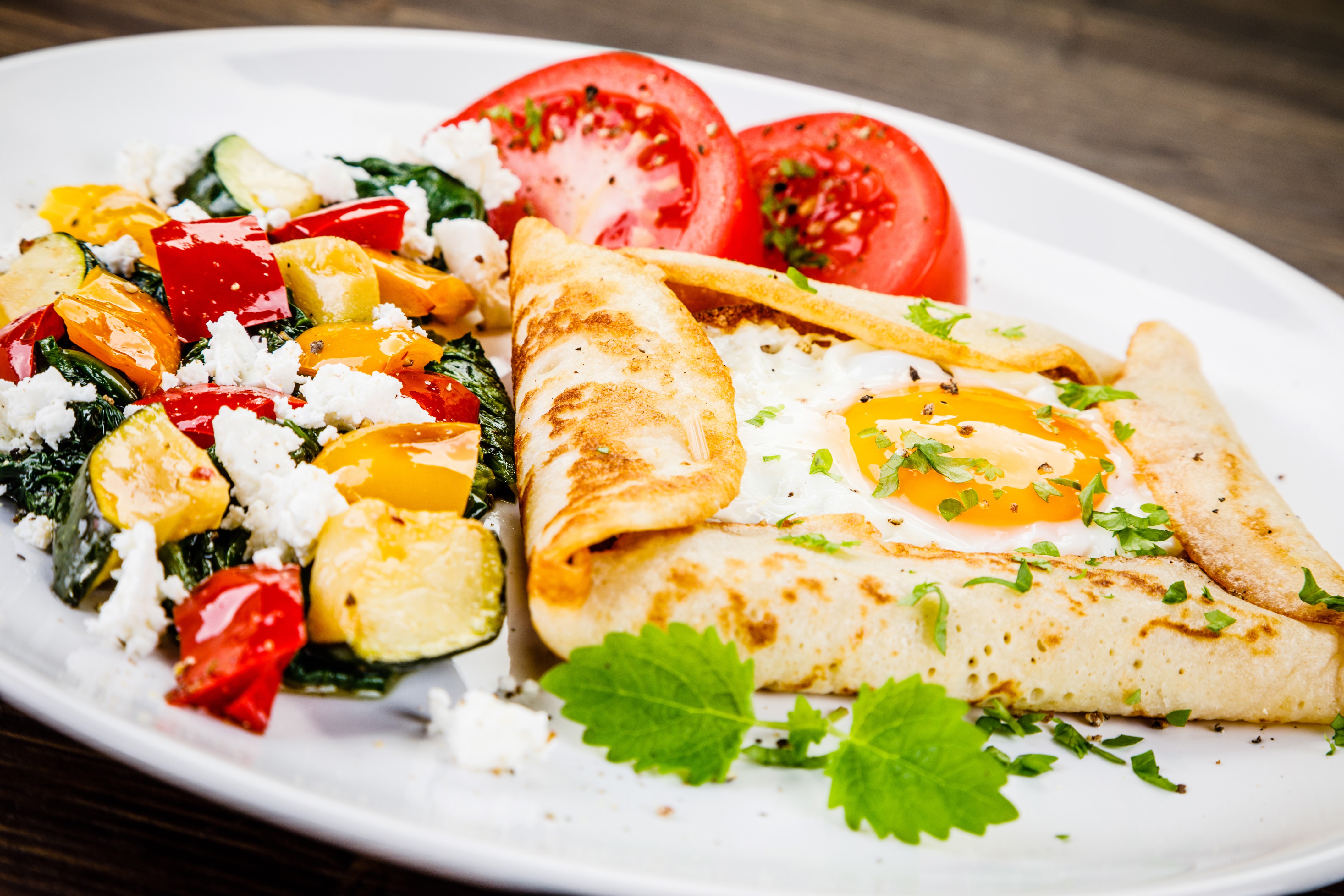 Pancake with fried egg and vegetable salad HD Wallpaper