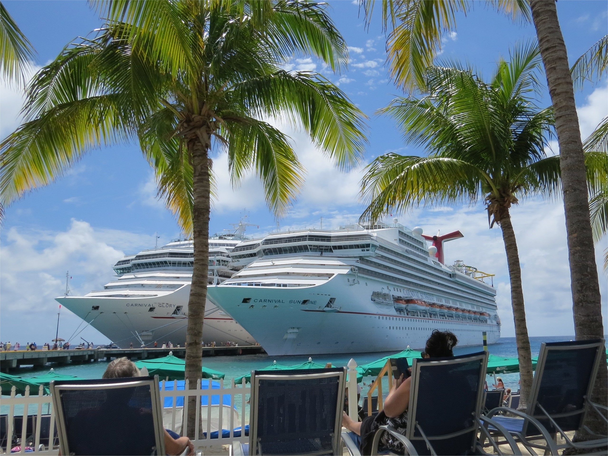 Carnival Glory and Sunshine cruise ships docked with palm trees HD Wallpaper