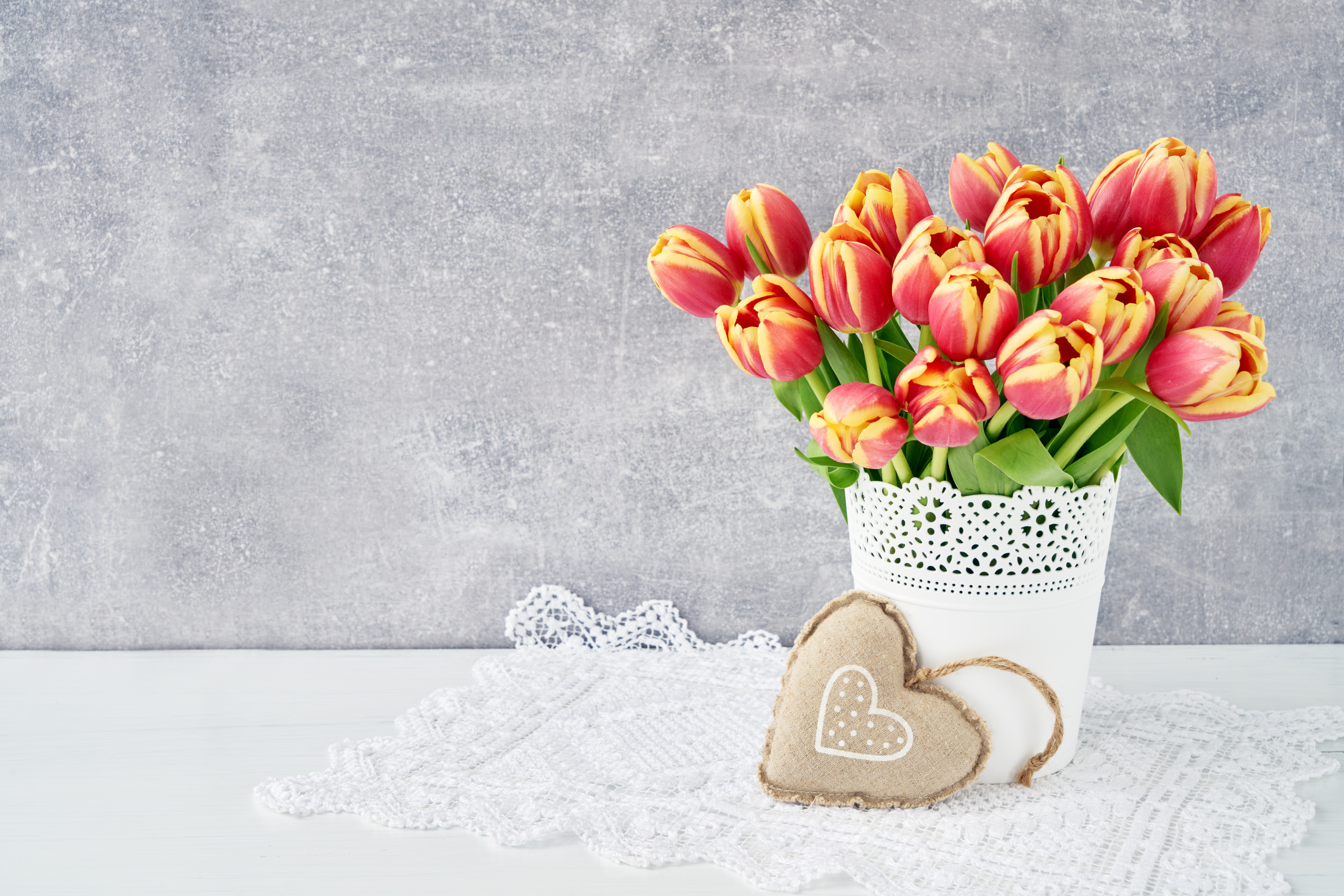 Tulips in a vase with heart decorations HD Wallpaper