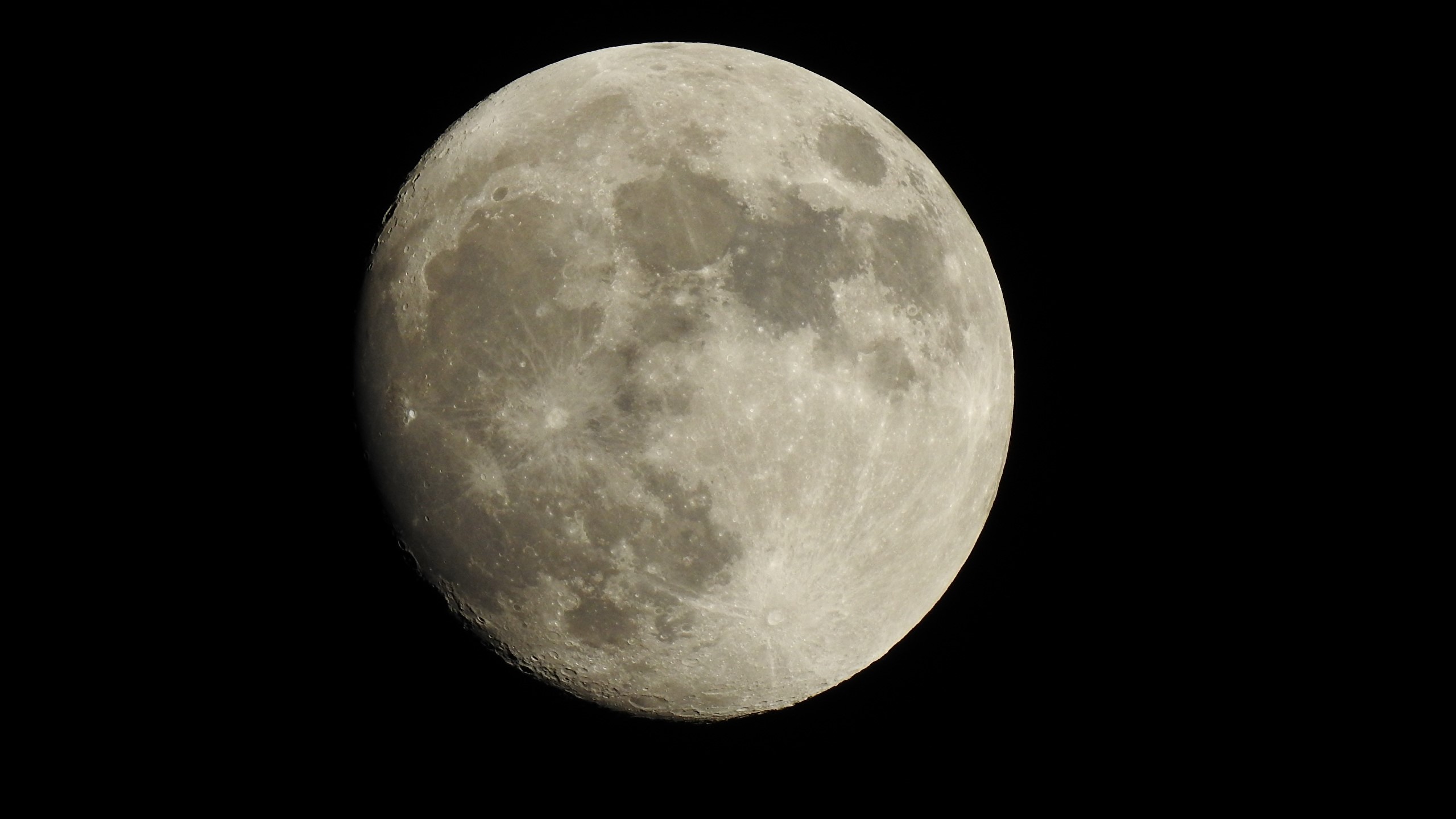 The Moon against a black background HD Wallpaper