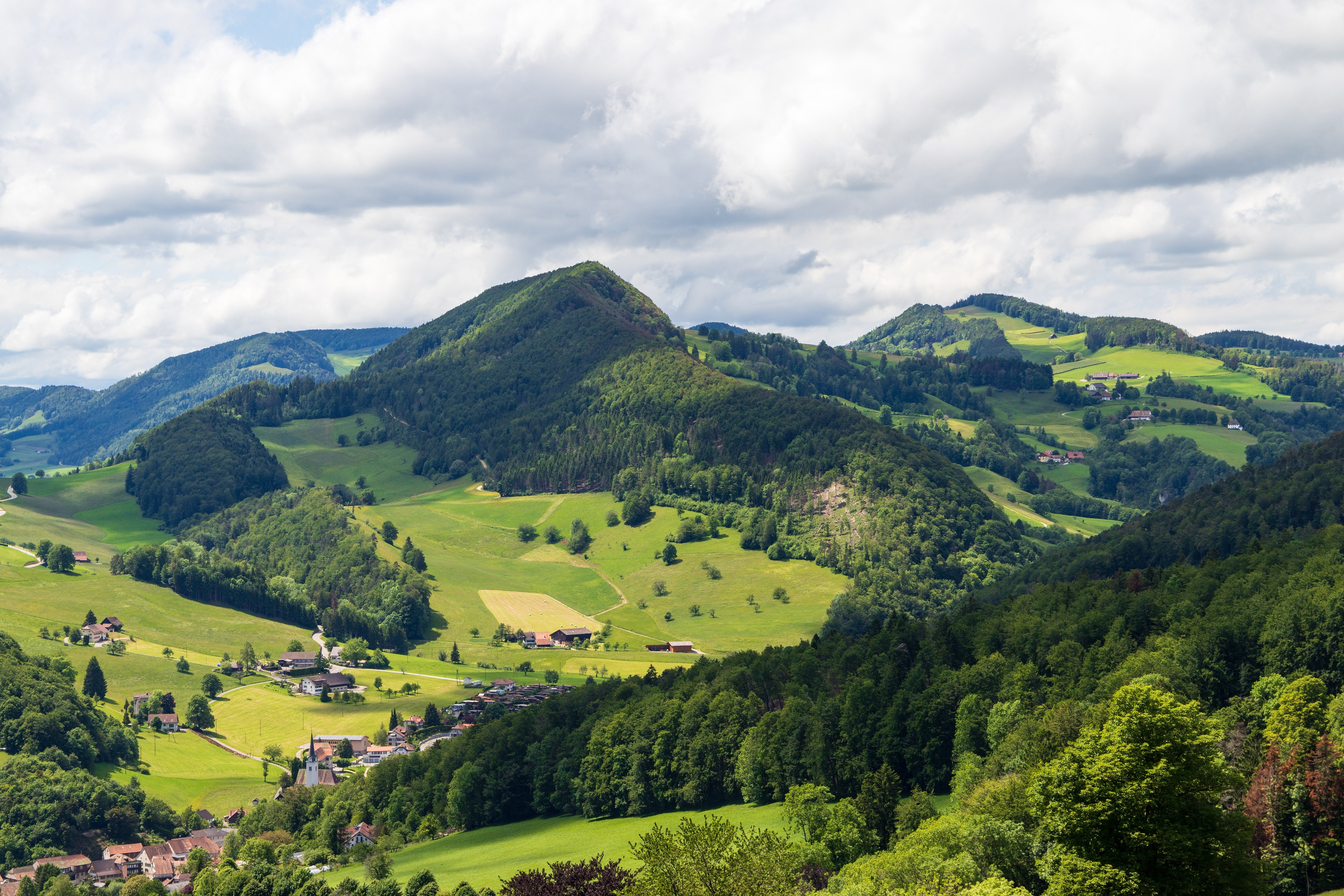 Green rolling hills and forests in Waldenburg County, Switzerland HD Wallpaper
