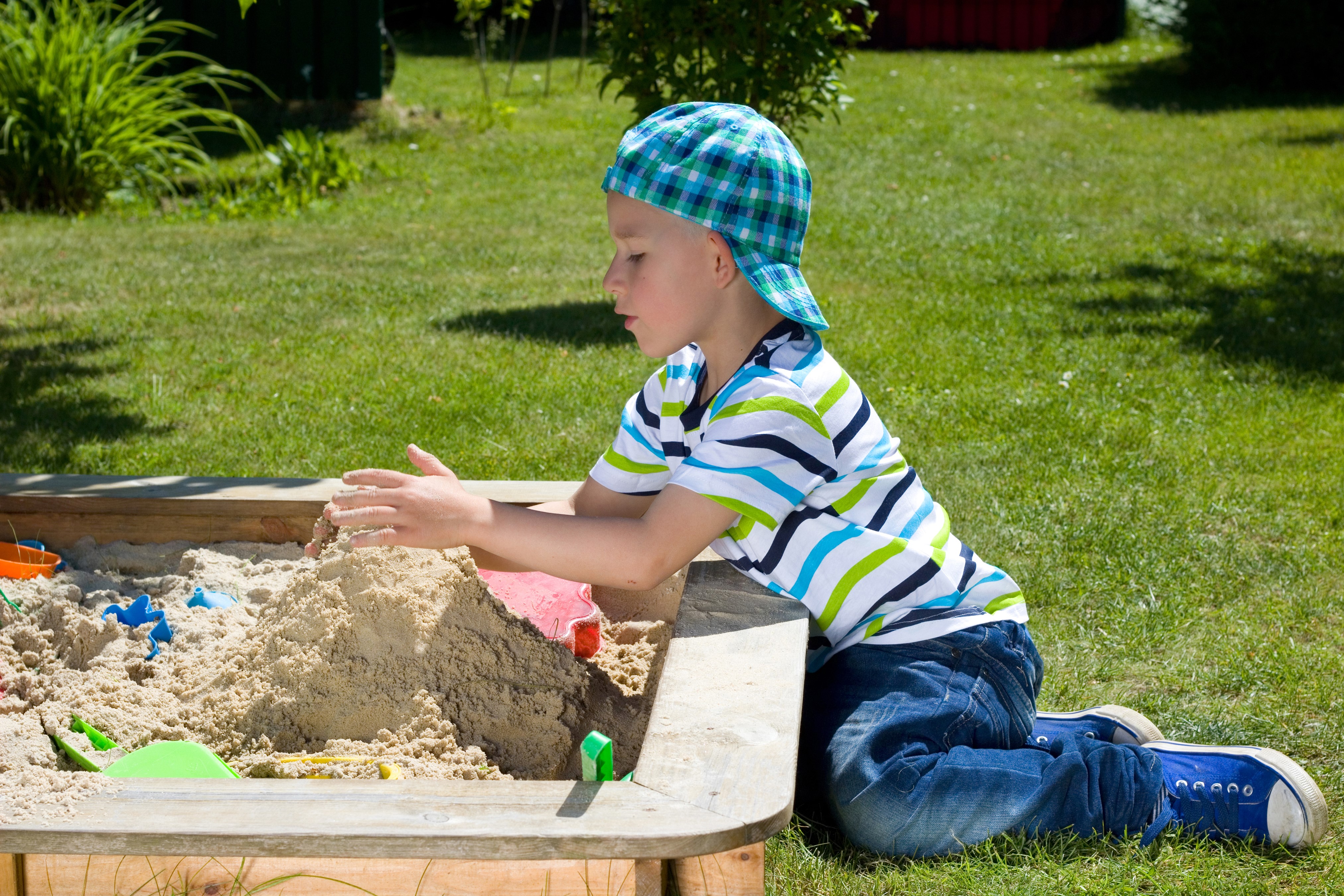Boy Playing in Sandbox HD Wallpaper