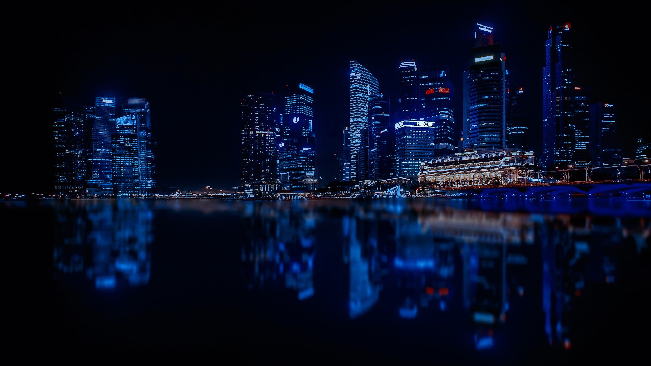 Singapore skyscrapers at night with reflections HD Wallpaper