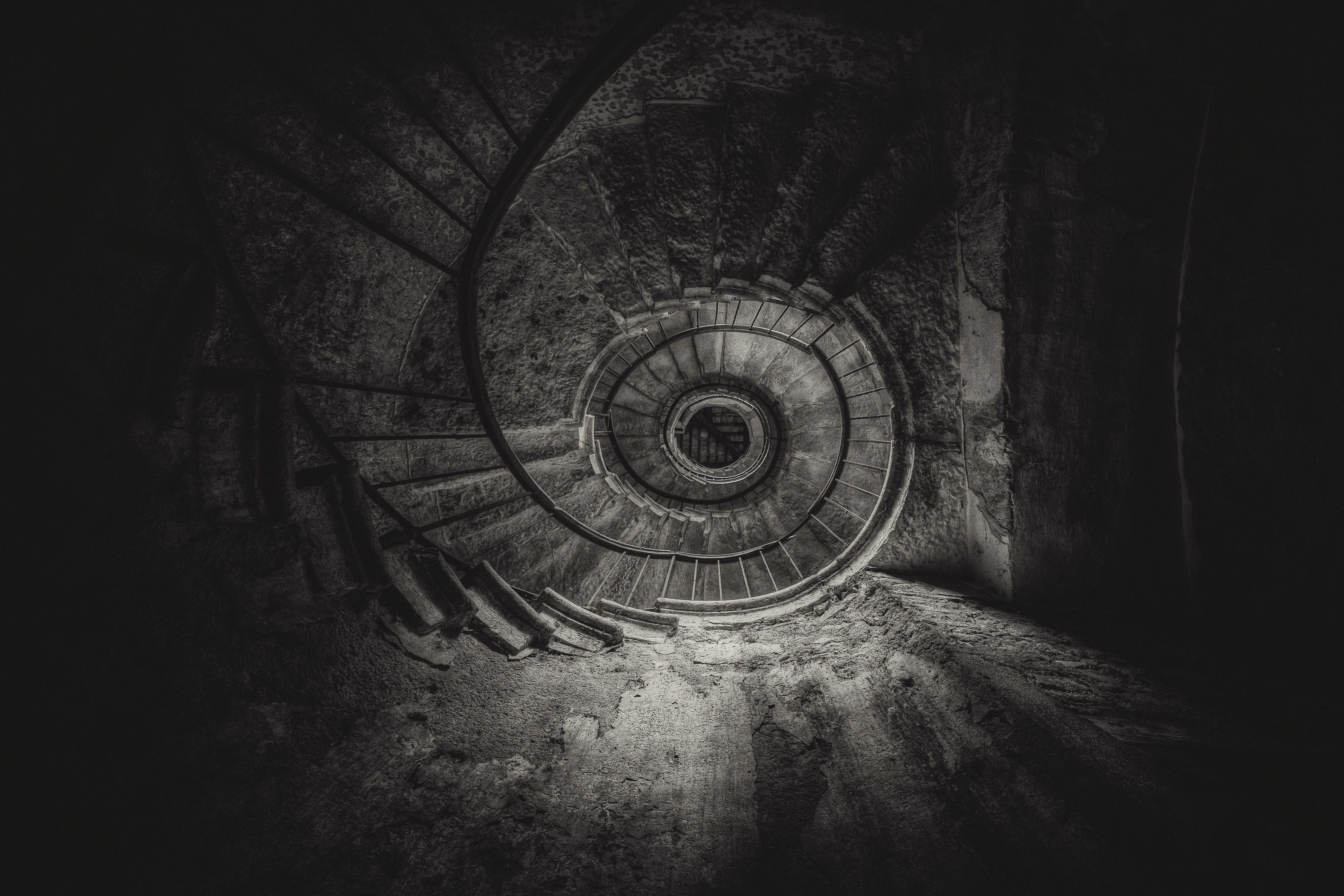 Black and white bottom view of old spiral stairs HD Wallpaper