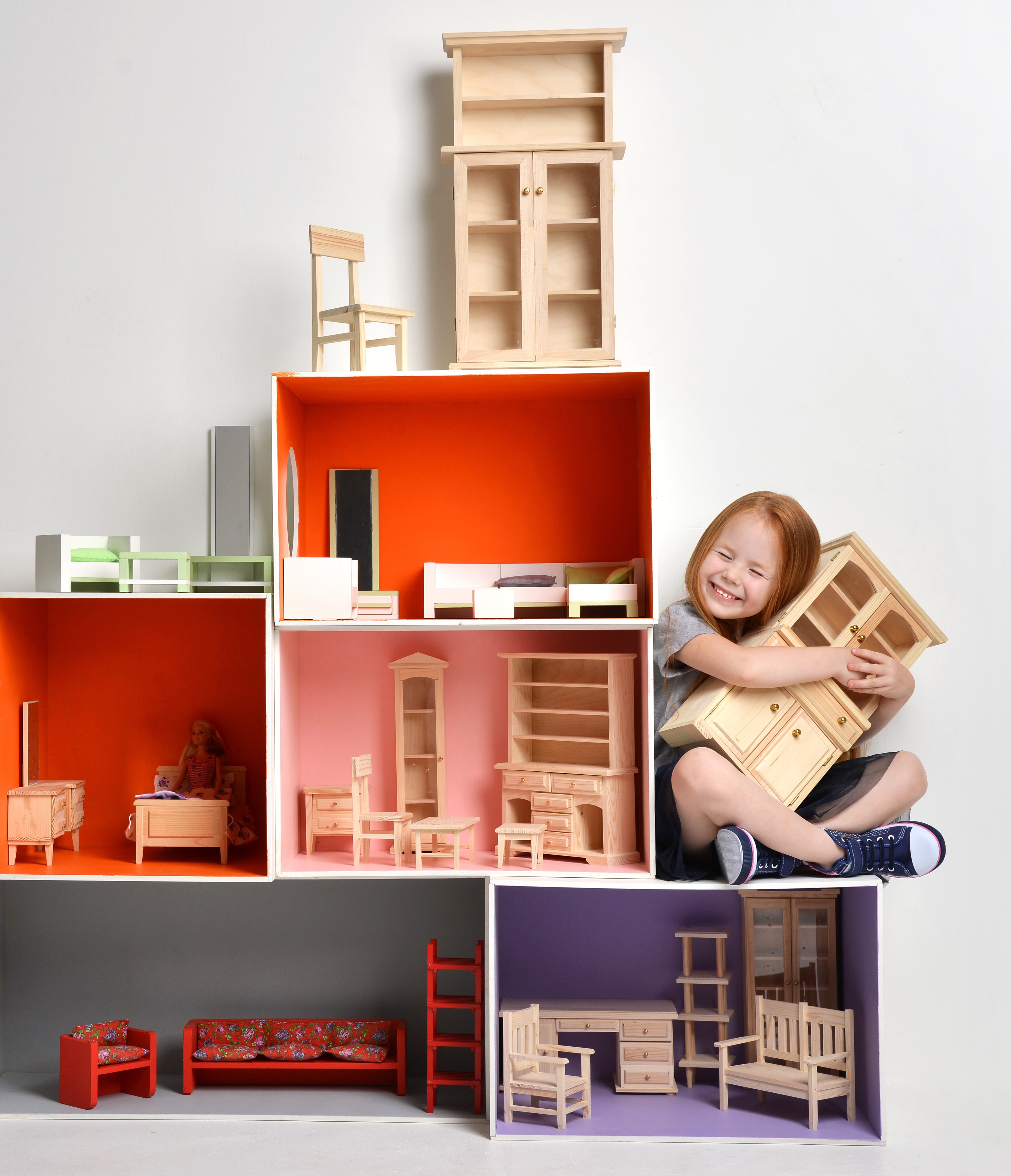 Girl hugging dollhouse furniture HD Wallpaper