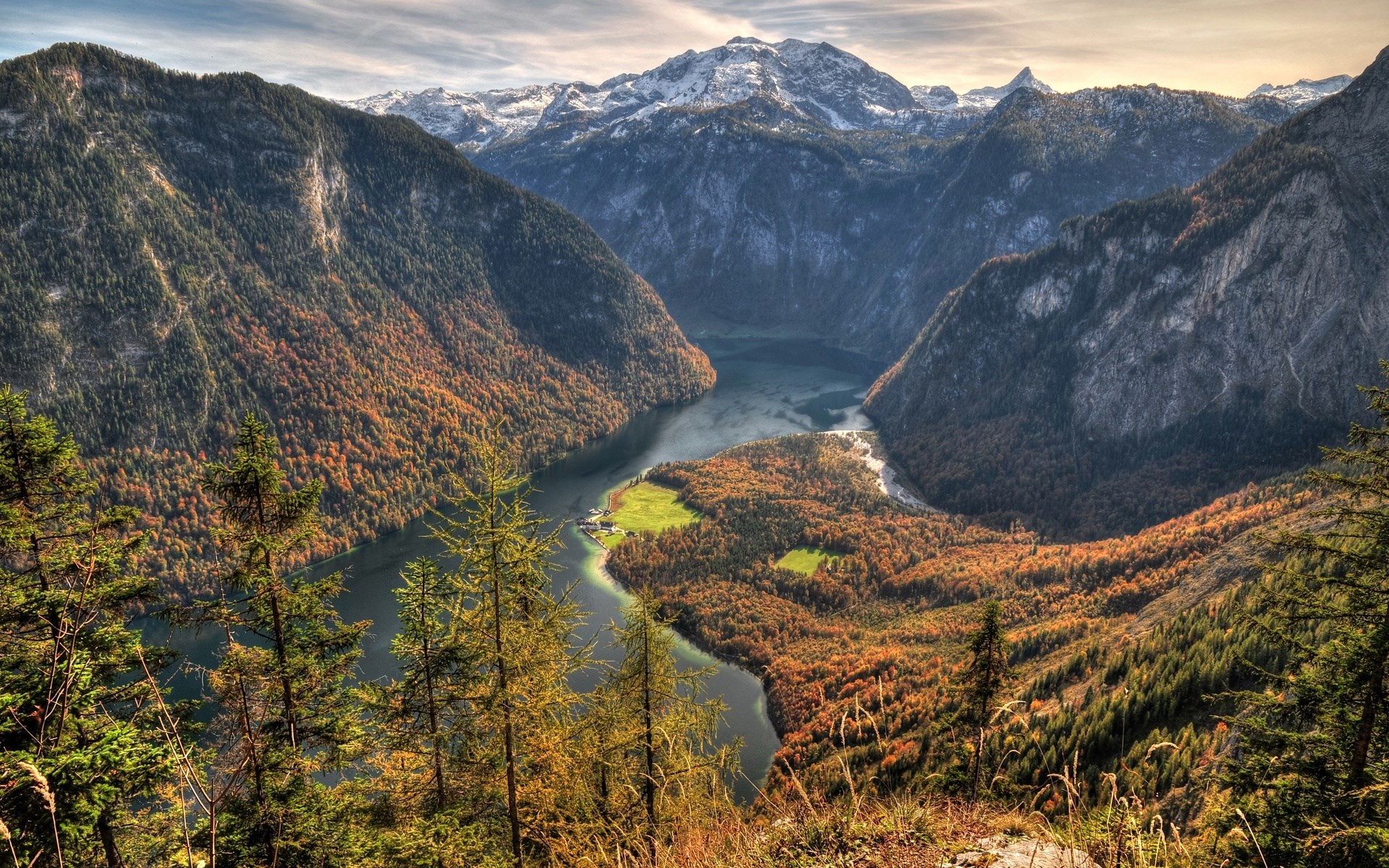 Mountain lake surrounded by autumn forest and snow-capped peaks HD Wallpaper
