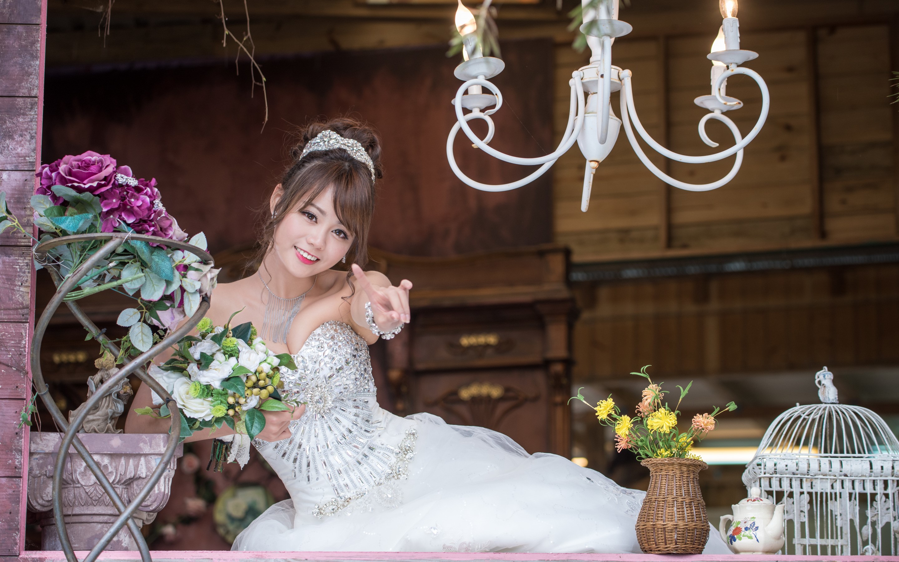 Bride in a sparkling dress holding bouquets HD Wallpaper
