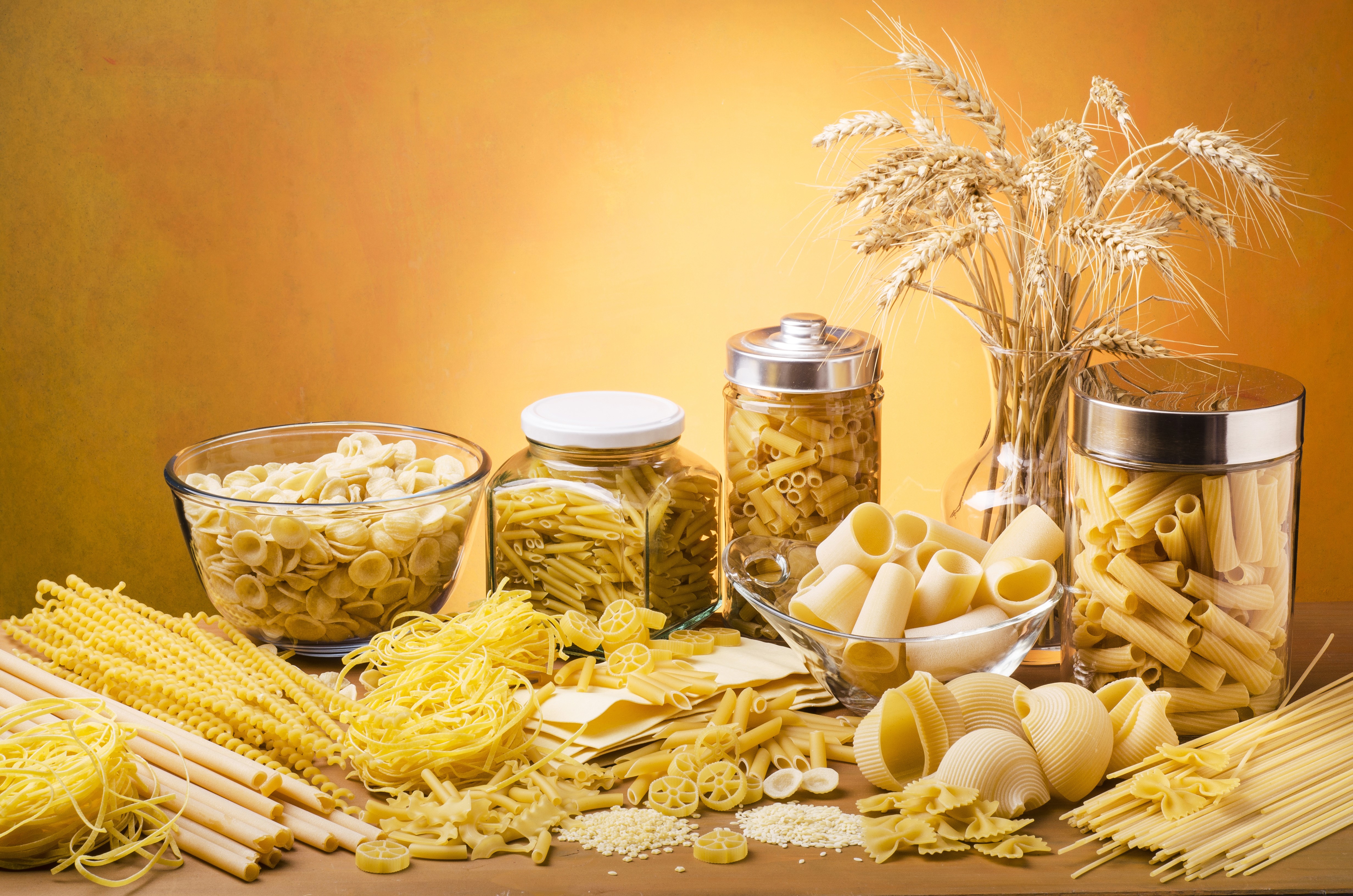 Various pasta types and wheat stalks HD Wallpaper
