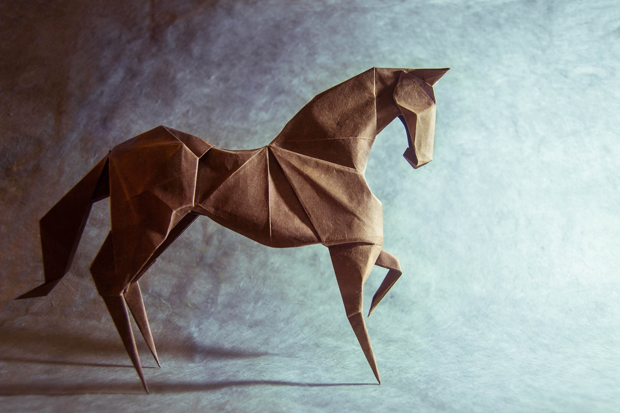 Brown origami horse on a textured background HD Wallpaper