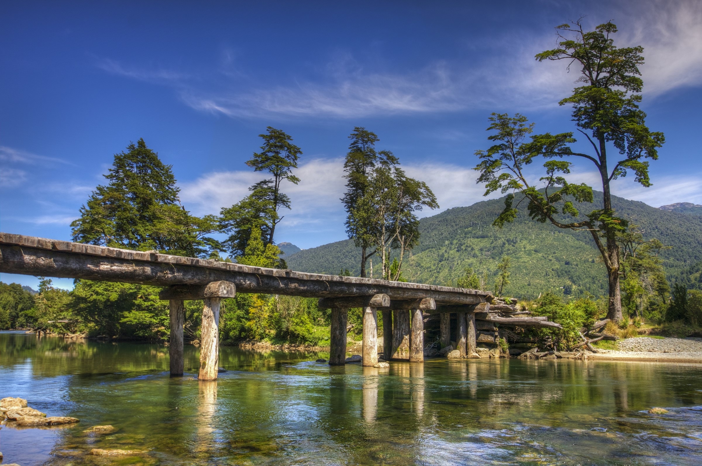 Wooden bridge over a river in Patagonia, Chile HD Wallpaper