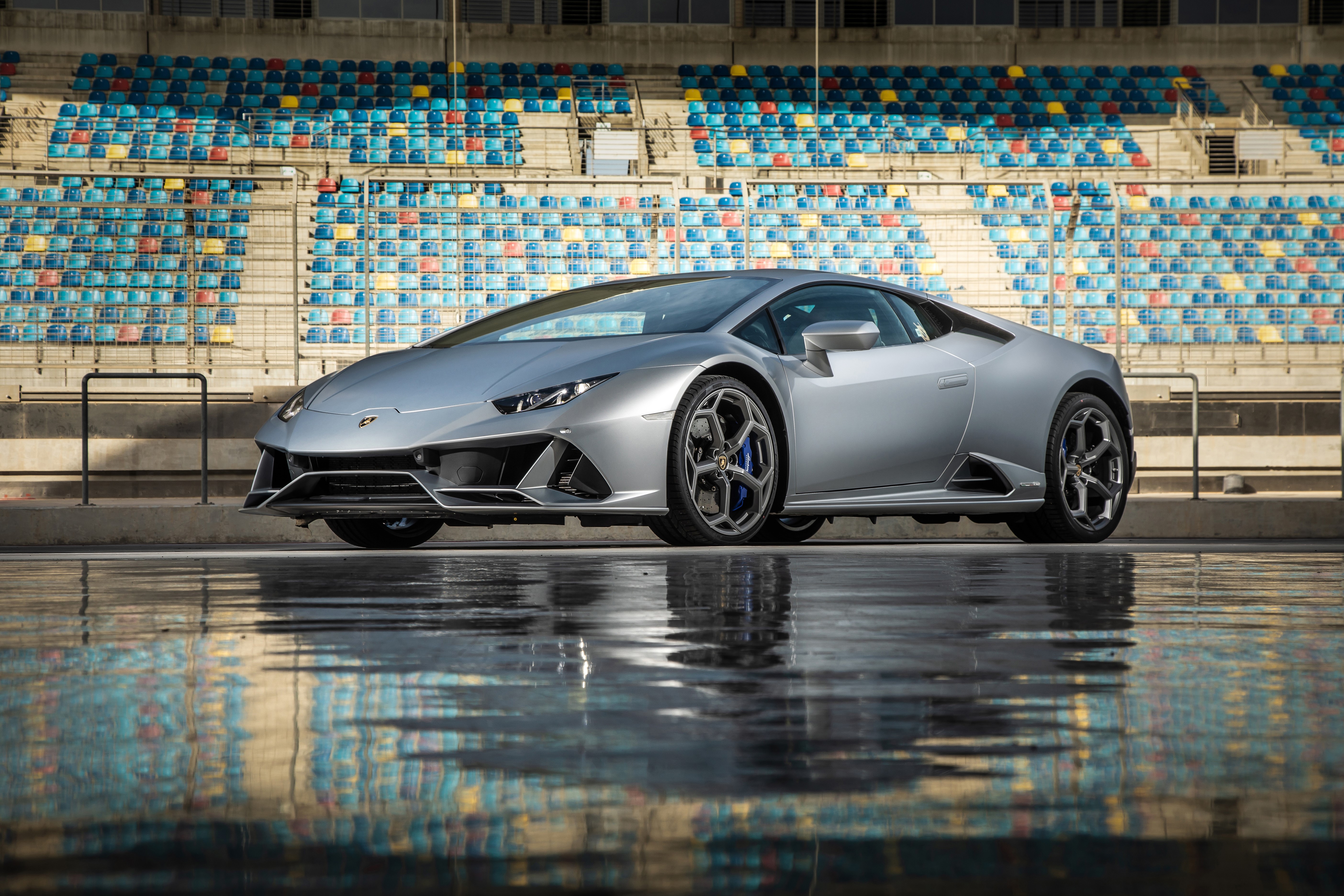 Grey Lamborghini on a wet racetrack HD Wallpaper