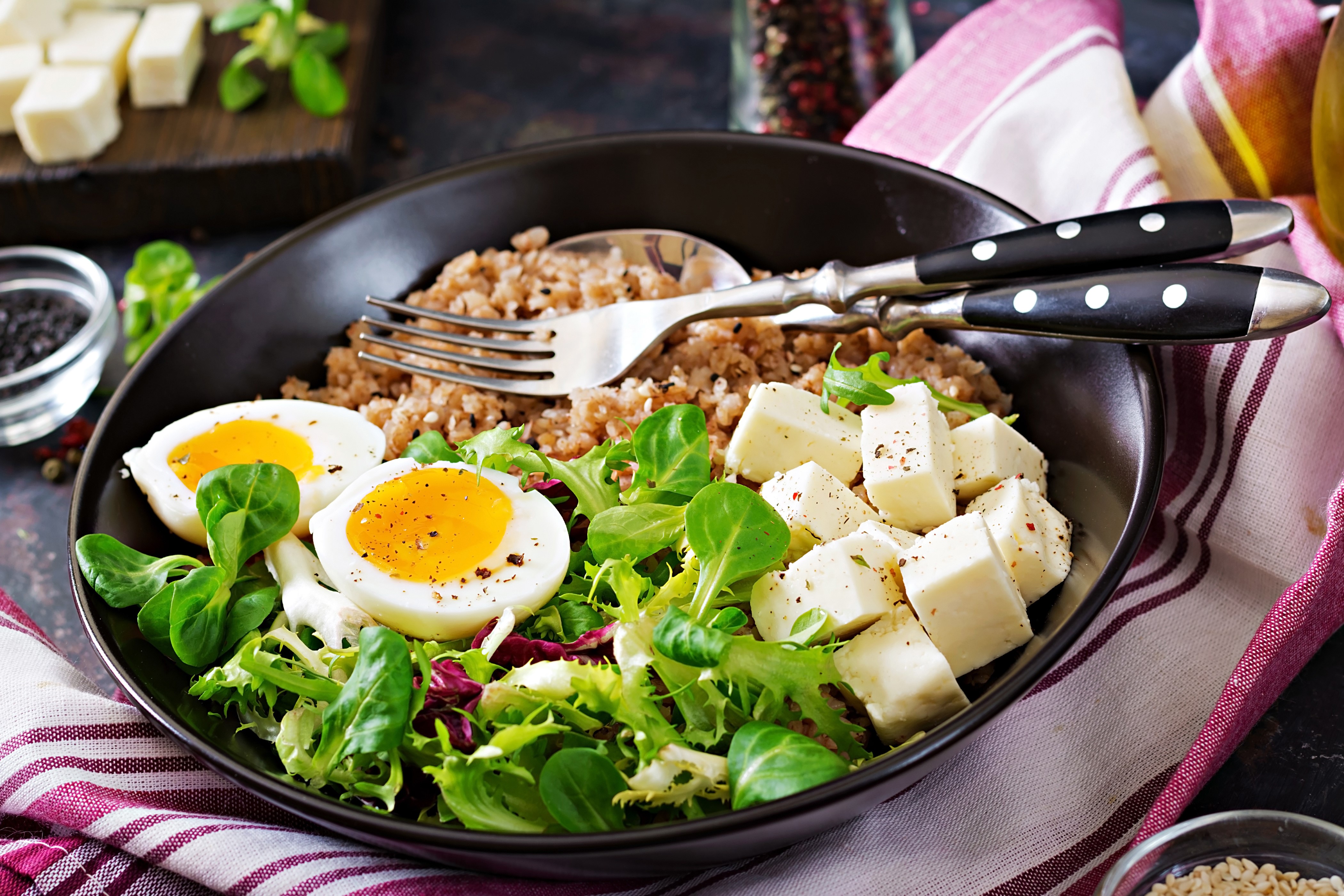 Buckwheat bowl with eggs, cheese, and salad HD Wallpaper