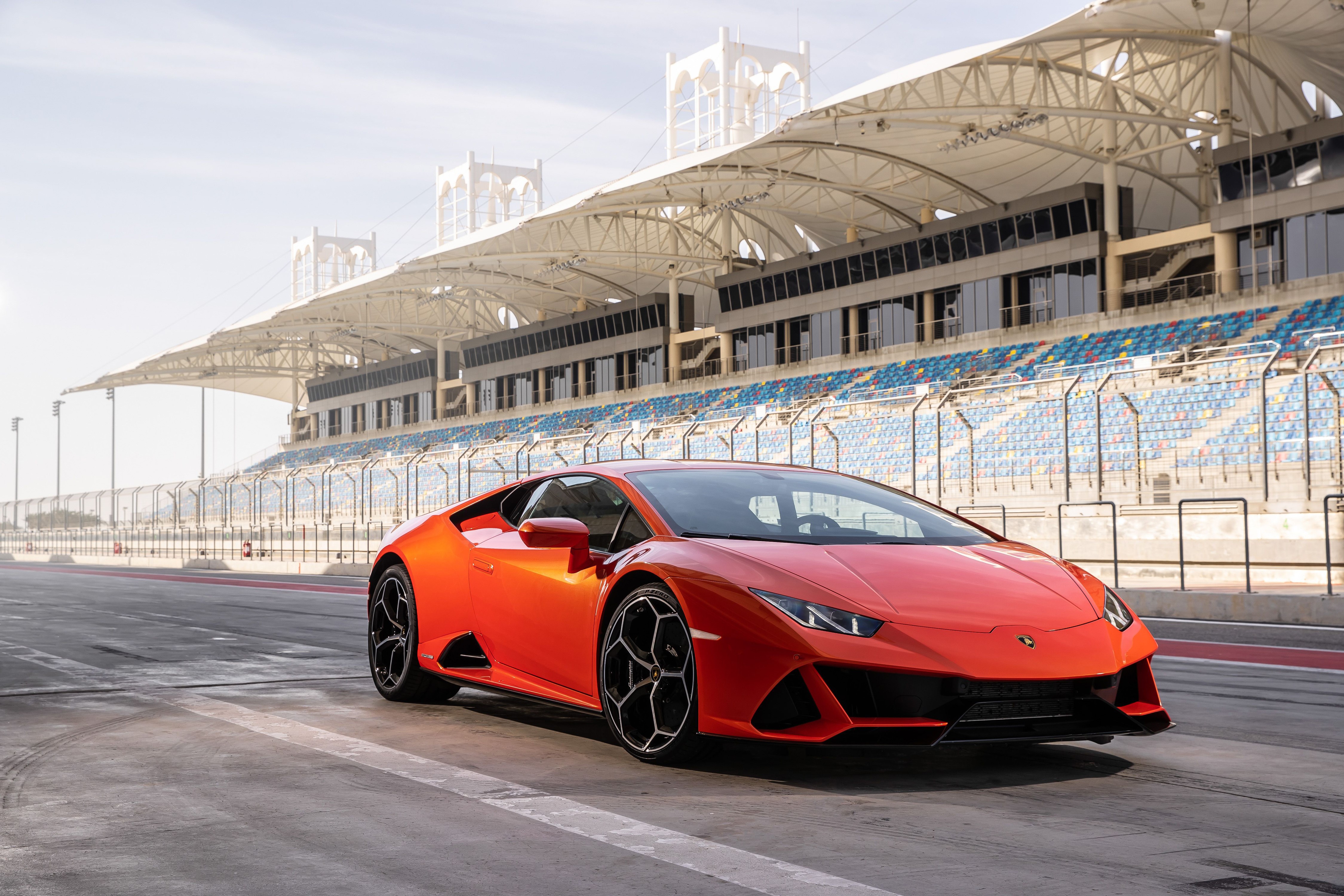 Orange Lamborghini on a Race Track HD Wallpaper