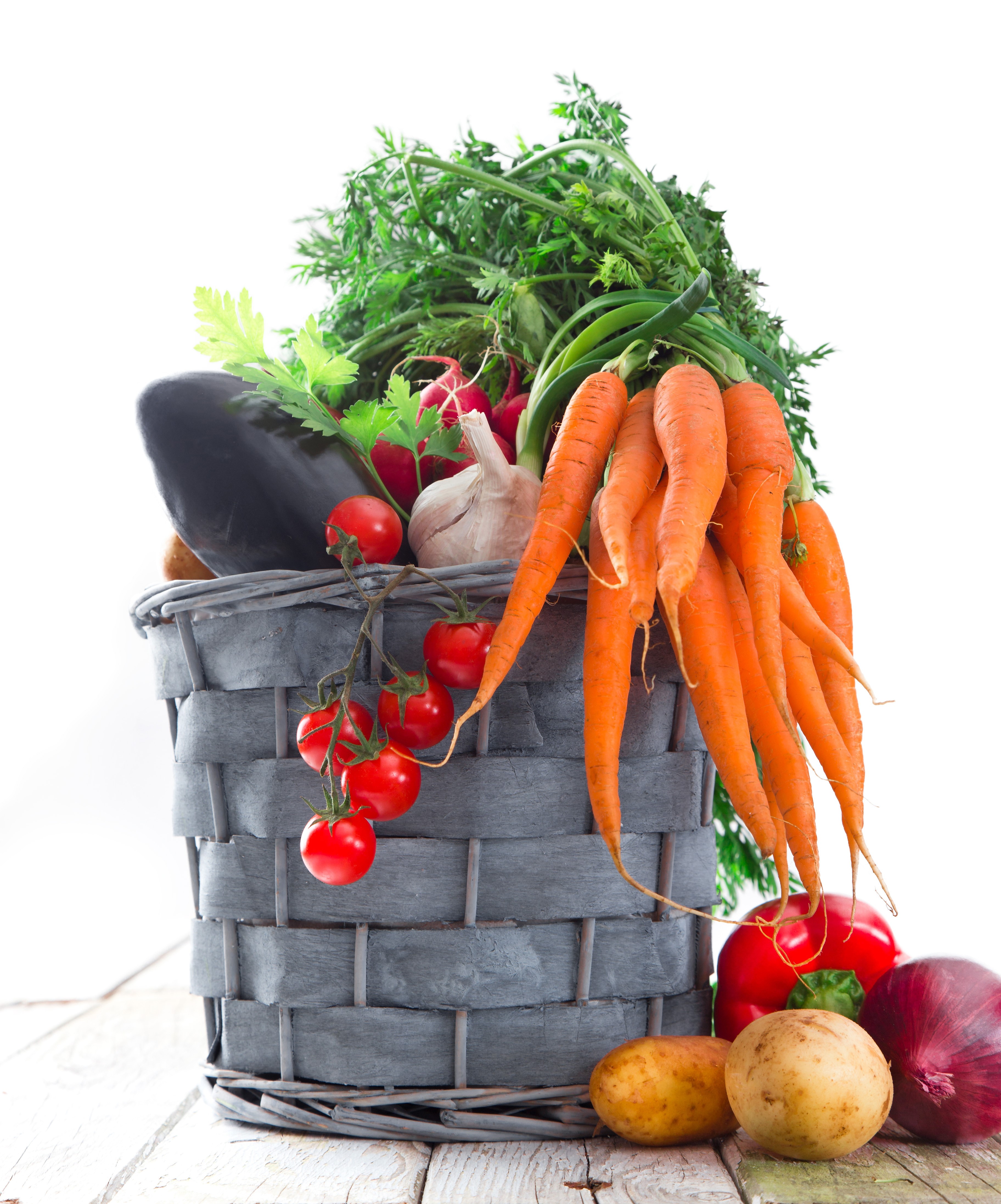 Basket of fresh vegetables including carrots, tomatoes, and eggplant HD Phone Wallpaper