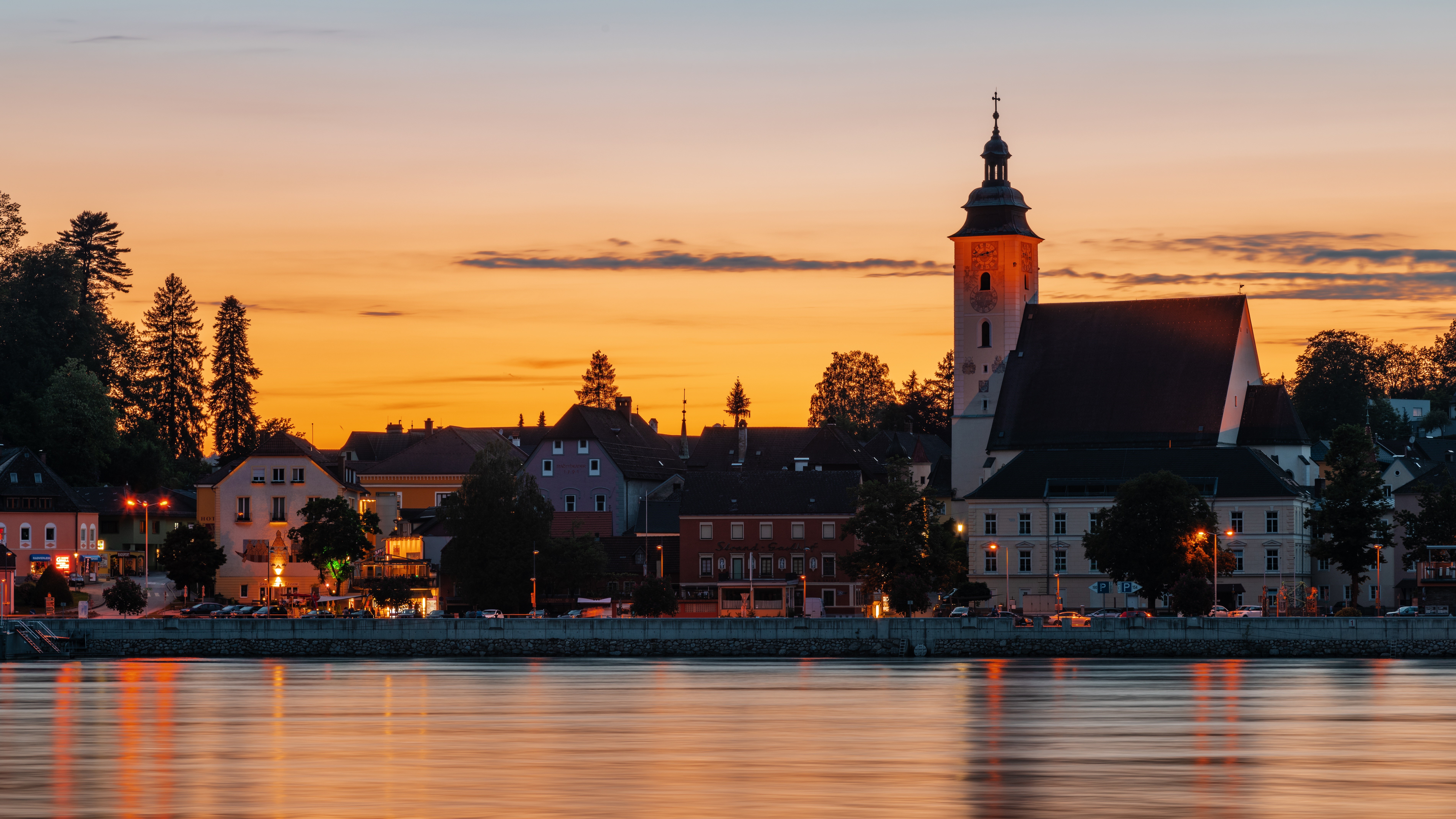 Town with Church on River at Sunset HD Wallpaper