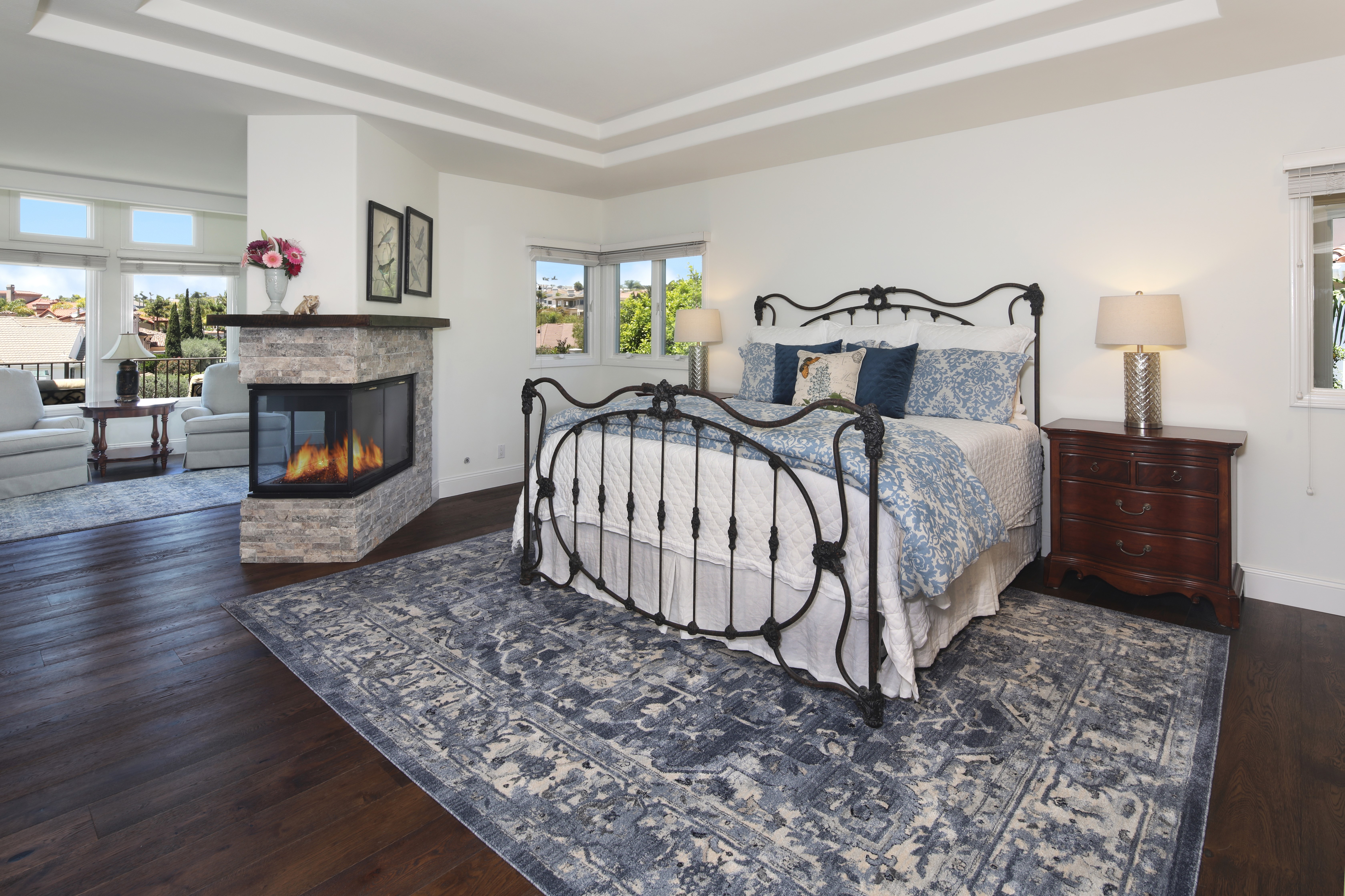 Bedroom with fireplace and ornate bed HD Wallpaper