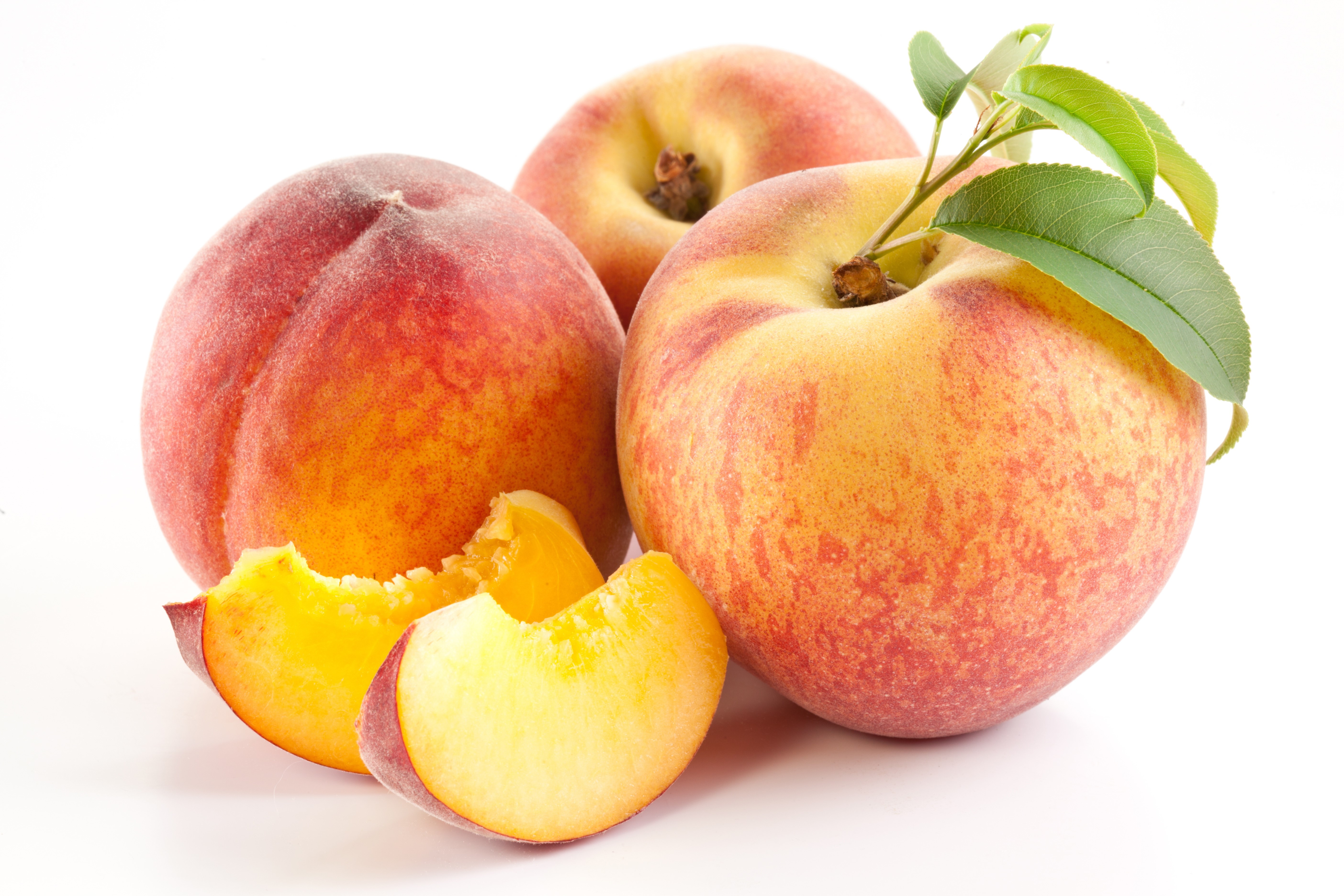 Three Peaches with Slices on White Background HD Wallpaper
