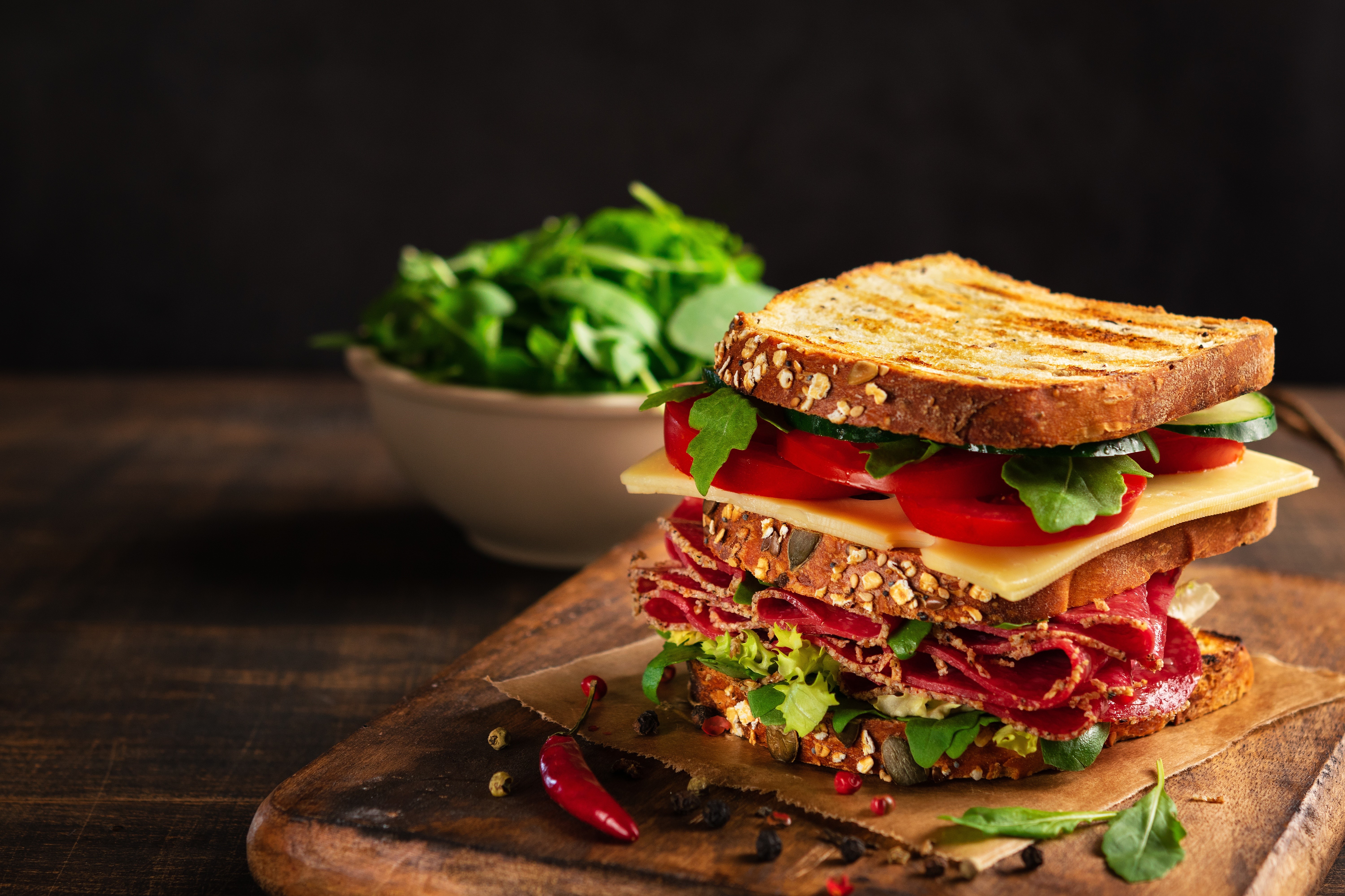 Sandwich with sausage, cheese, tomatoes, and salad HD Wallpaper