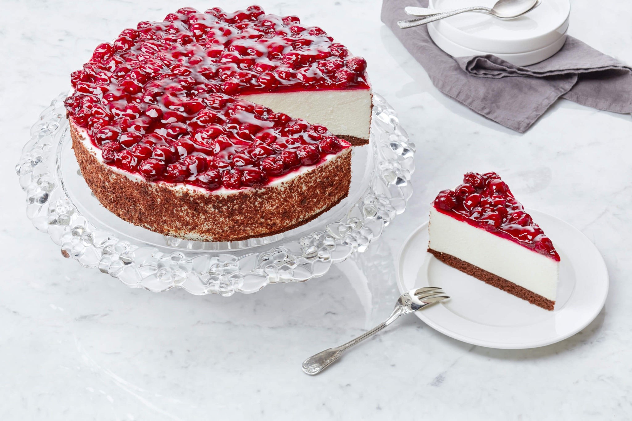 Cherry Cheesecake on a Pedestal with a Slice on a Plate HD Wallpaper