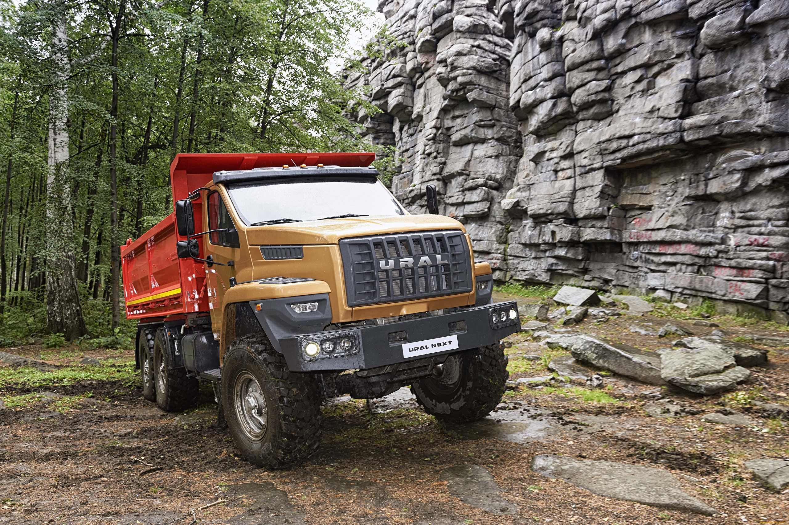 URAL NEXT dump truck parked near rocky cliffs HD Wallpaper
