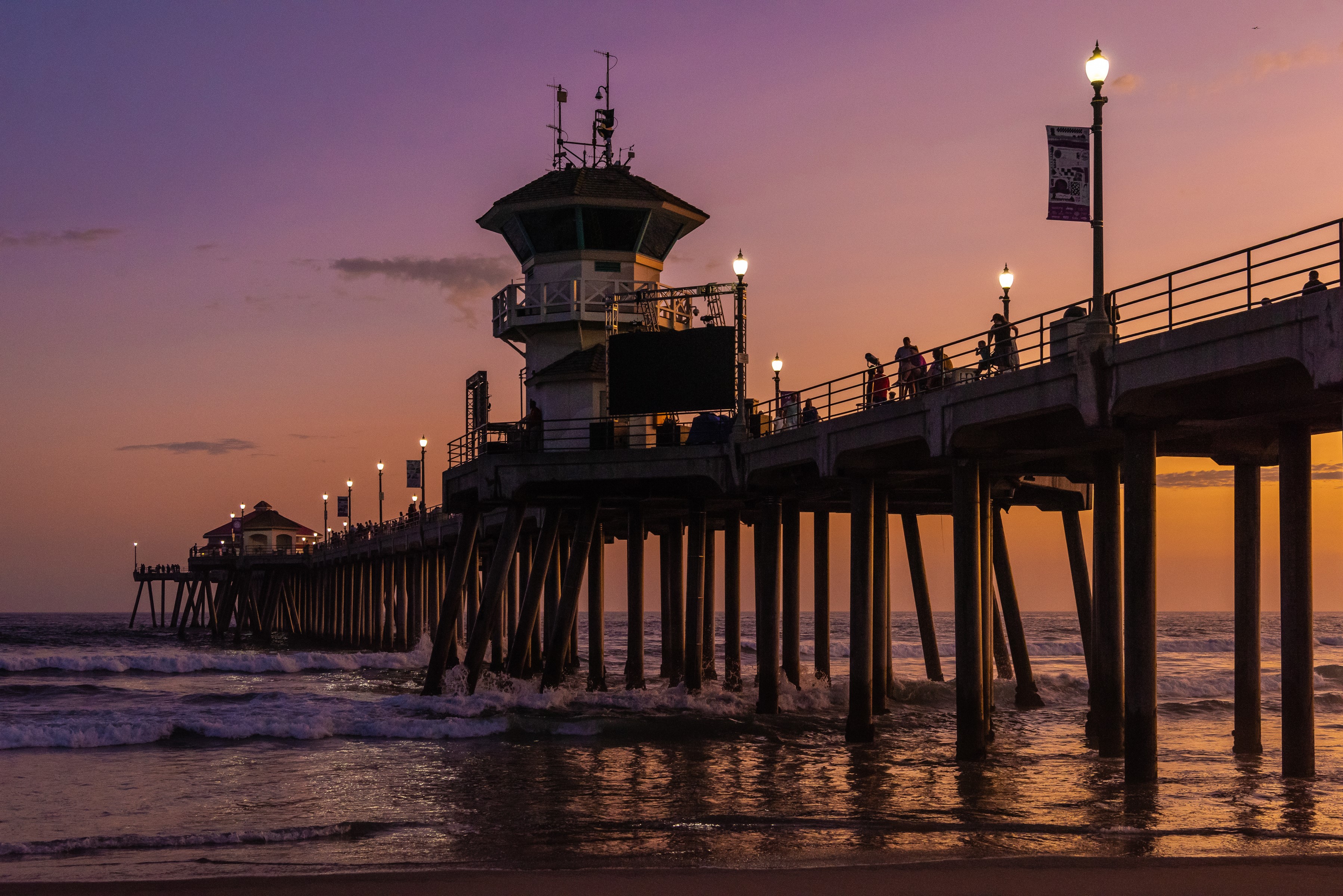 Huntington Beach Pier at sunset with waves HD Wallpaper
