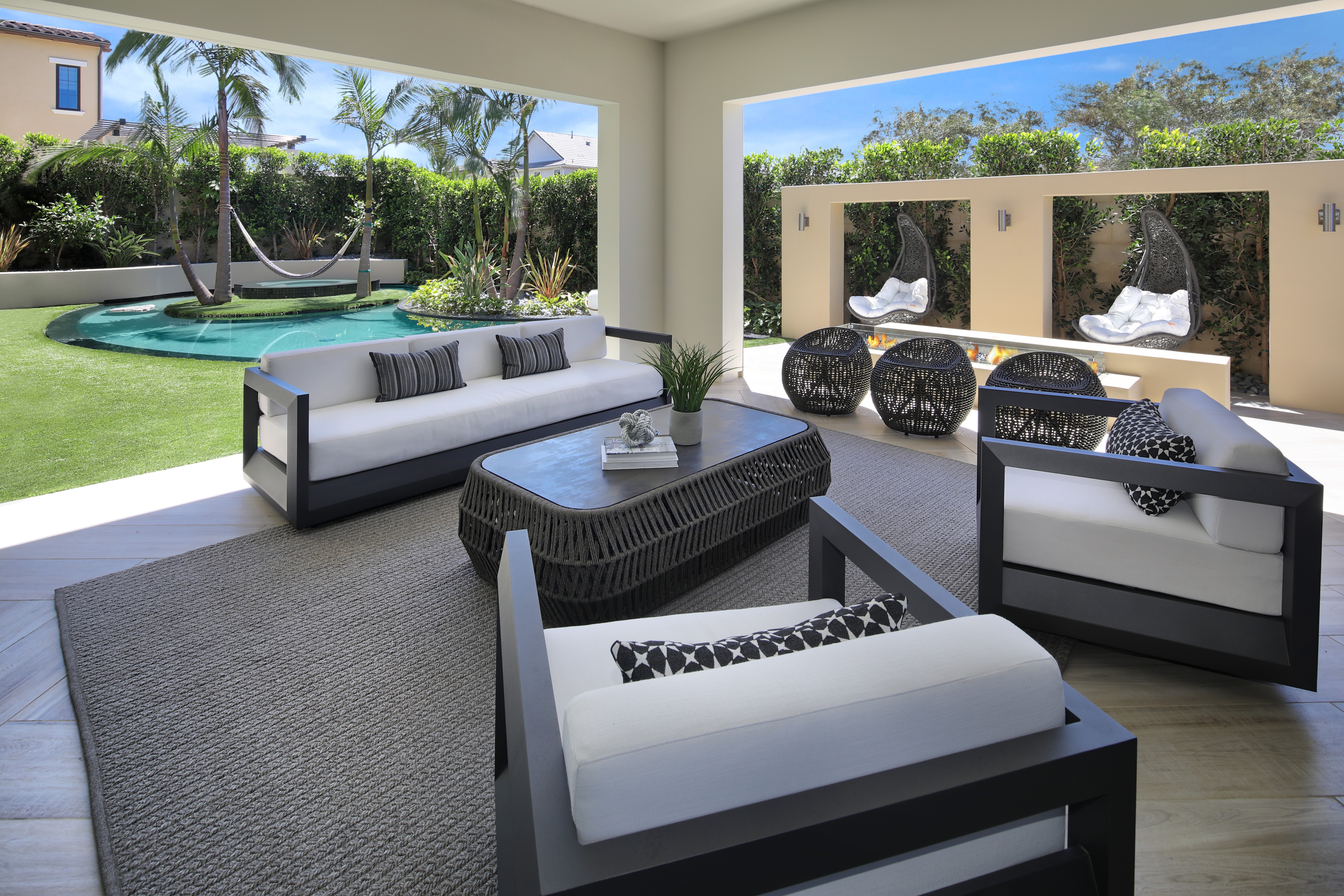Outdoor Living Room with Pool and Fireplace HD Wallpaper