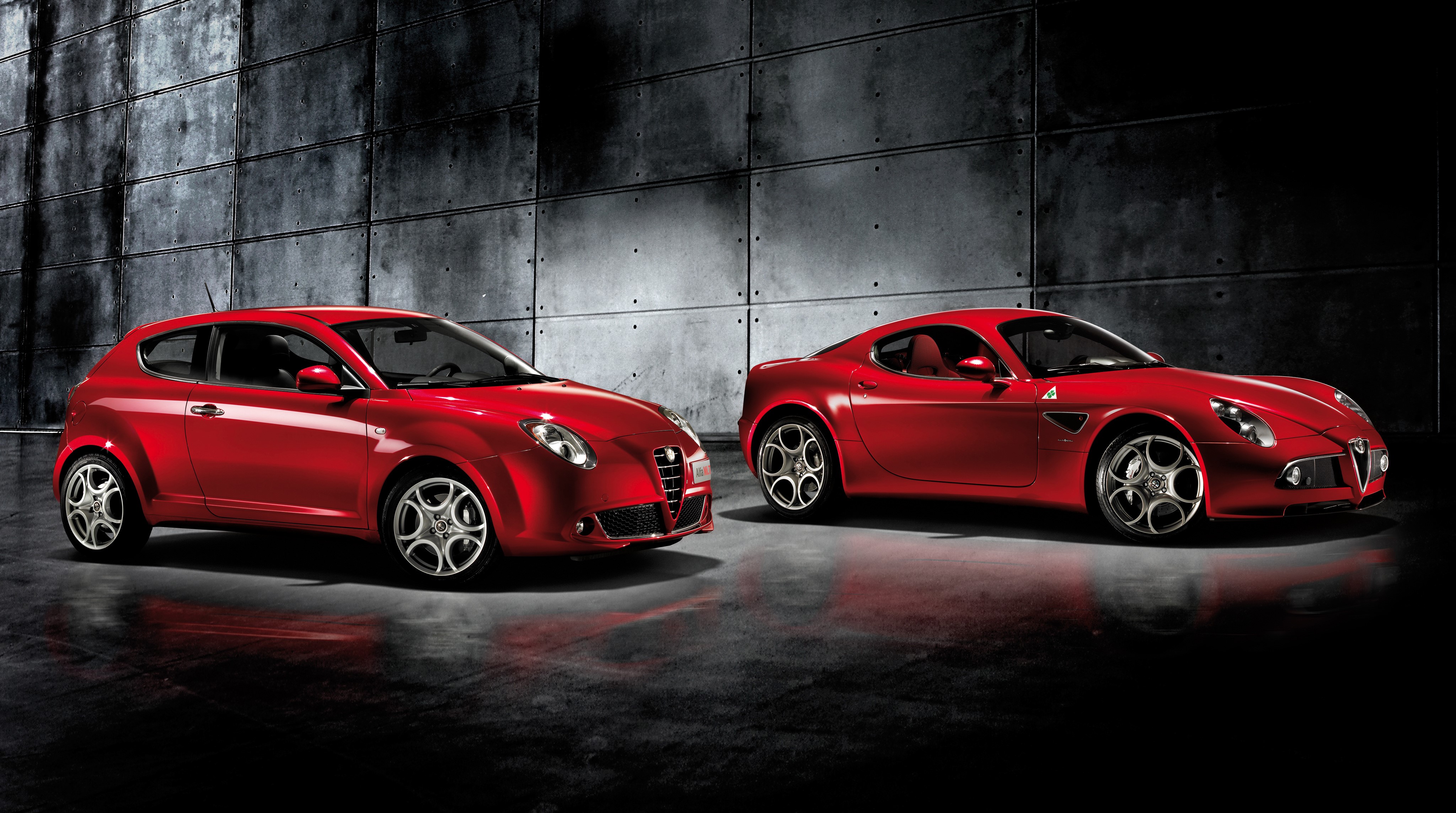Two red Alfa Romeo cars HD Wallpaper