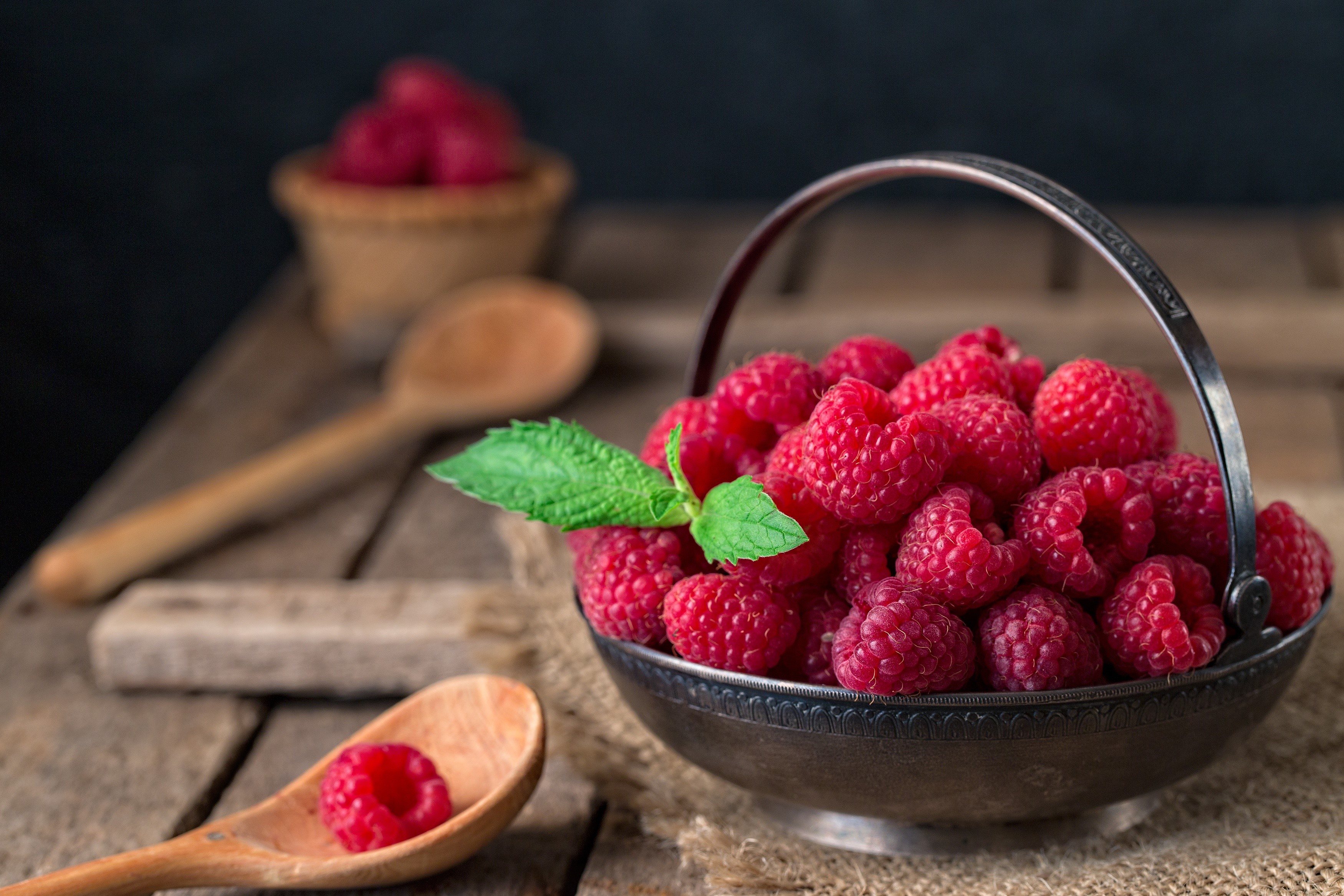 Raspberries in a metal bowl with mint leaf HD Wallpaper