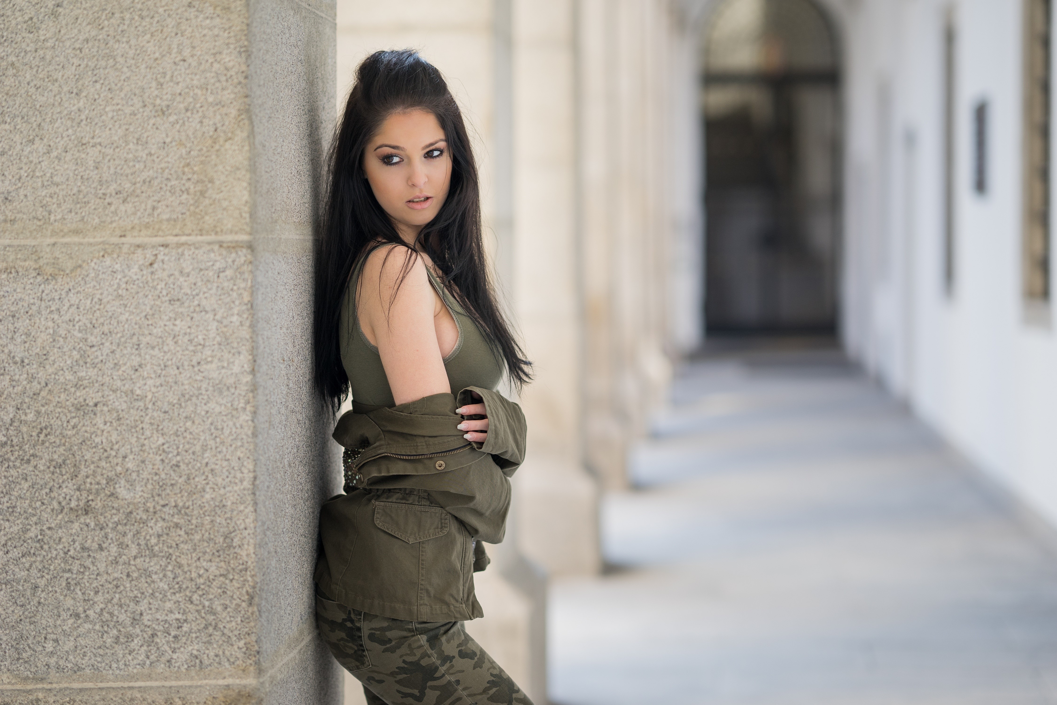 Brunette girl in jacket and camouflage pants HD Wallpaper