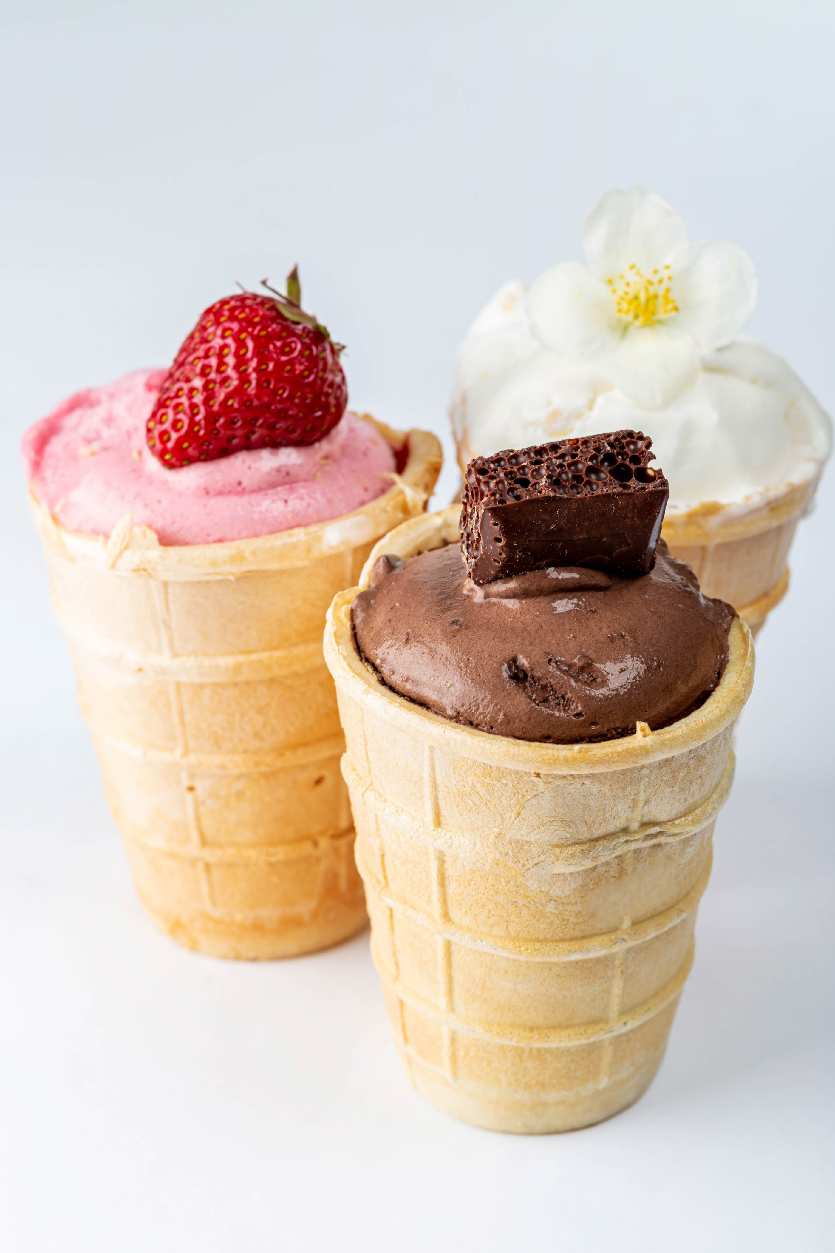 Three ice cream cones with strawberry, chocolate, and vanilla flavors HD Phone Wallpaper