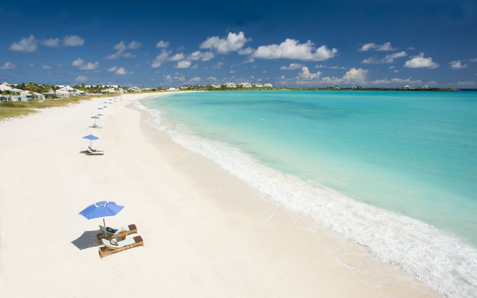 Tropical Beach with Lounge Chairs and Umbrellas HD Wallpaper