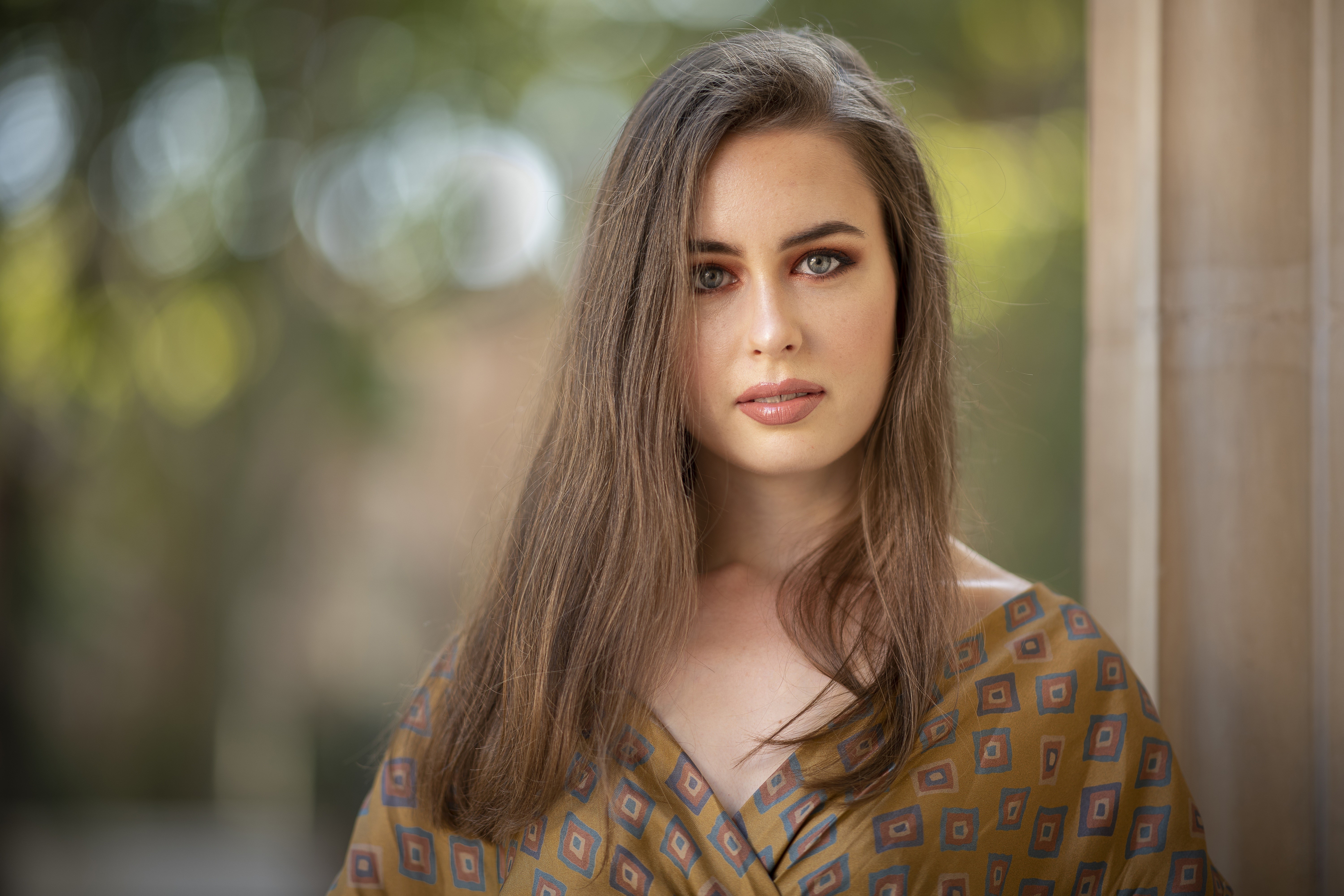 Woman with brown hair and patterned dress HD Wallpaper
