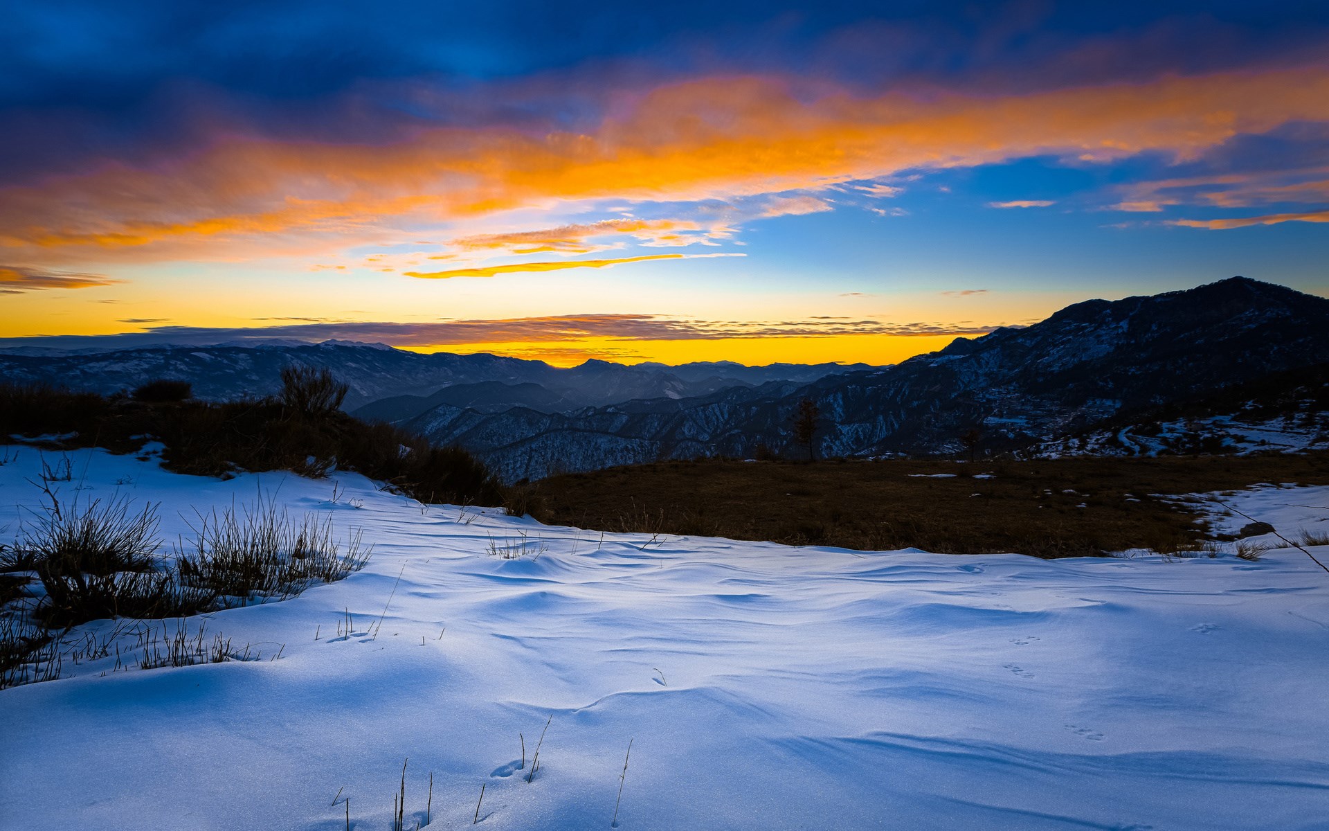 Snowy mountain landscape at sunset with colorful sky HD Wallpaper
