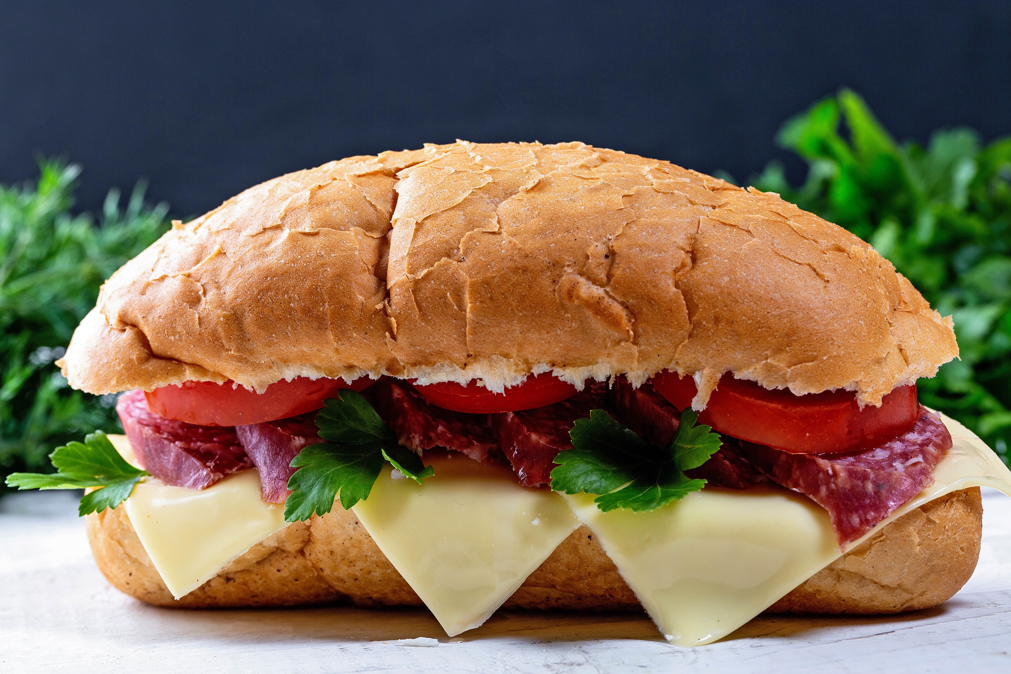 Sandwich with sausage, cheese, tomatoes, and parsley HD Wallpaper