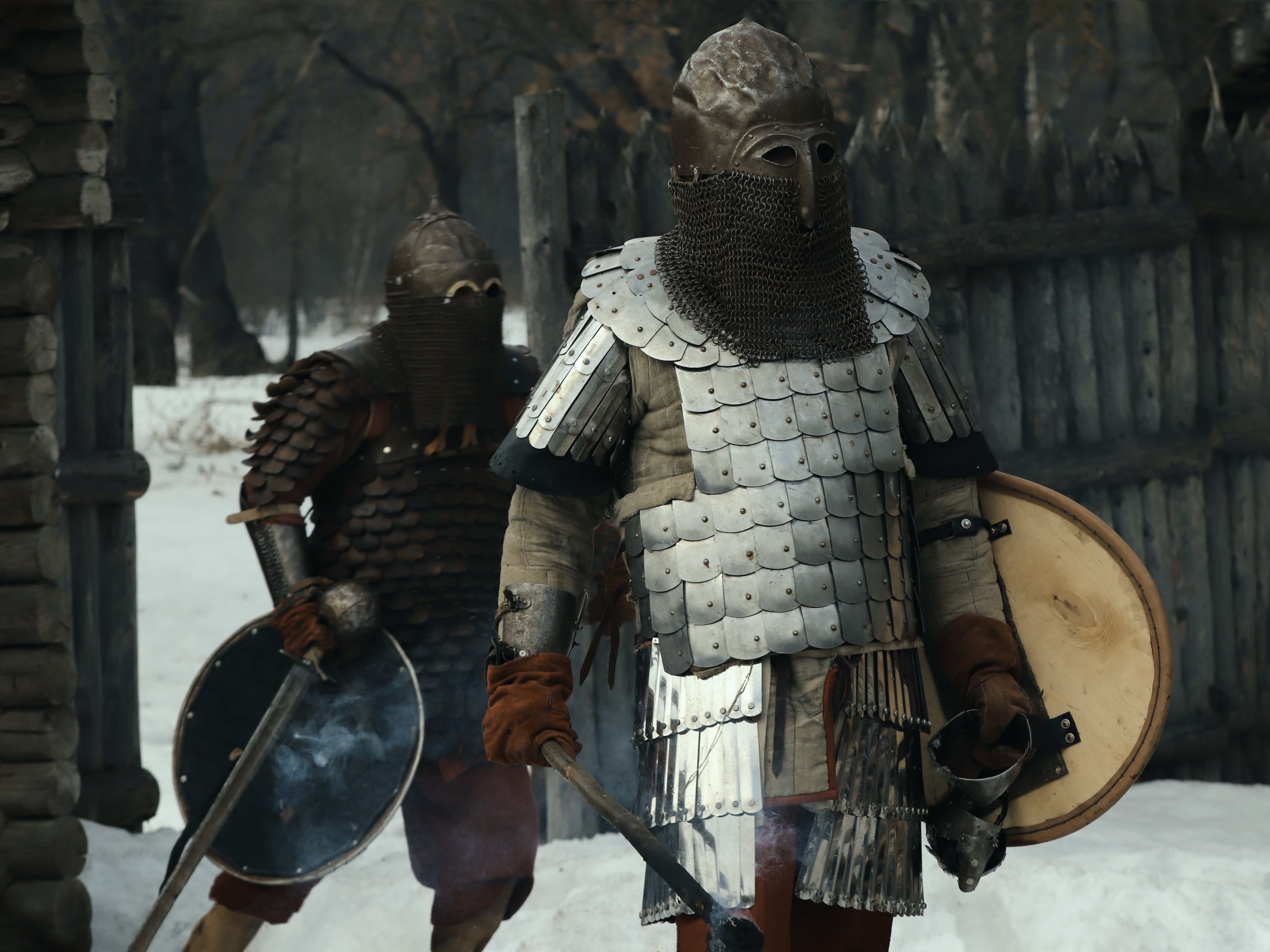 Two warriors in armor with helmets and shields HD Wallpaper