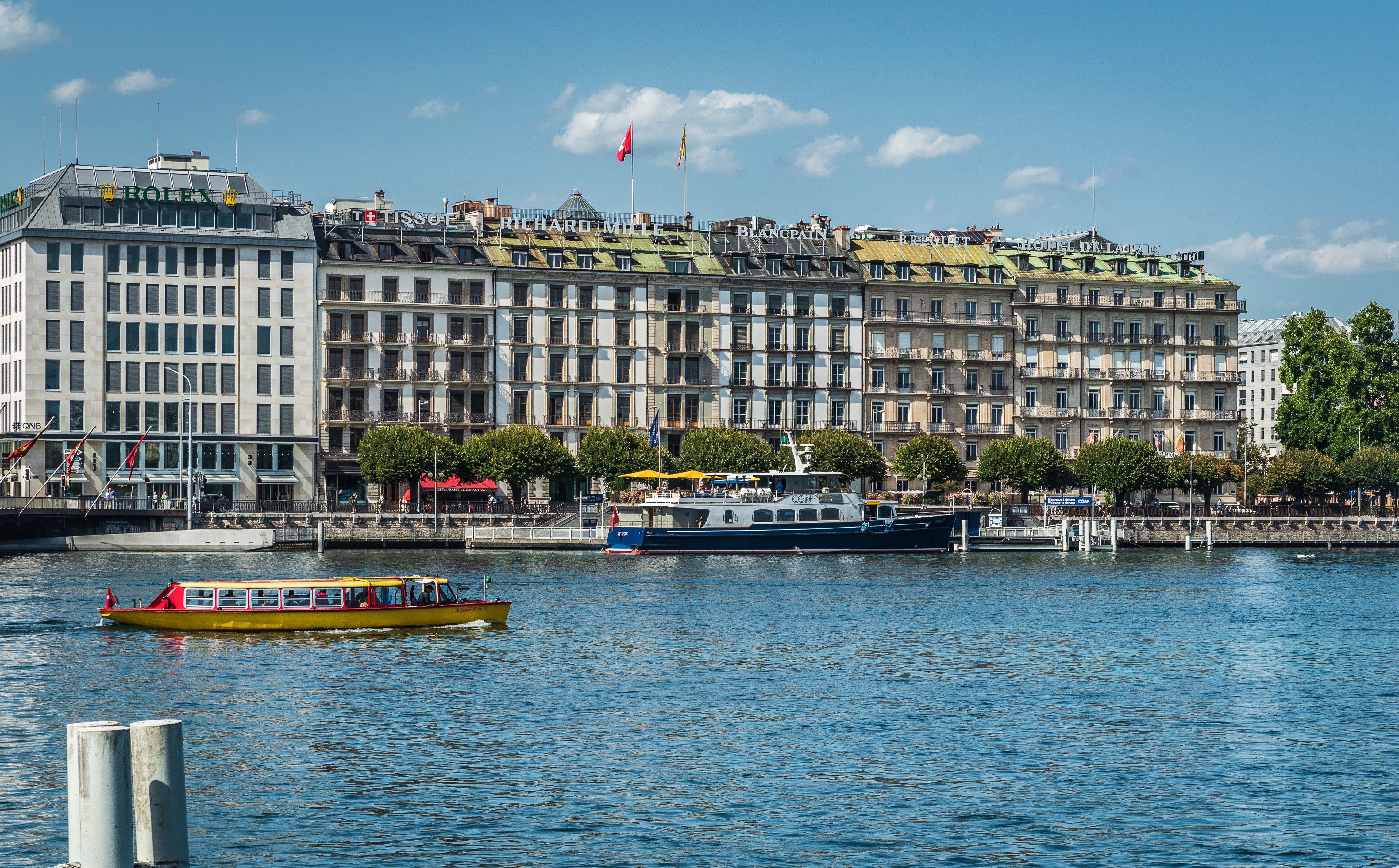 Geneva, Switzerland waterfront with Rolex and Blancpain buildings HD Wallpaper