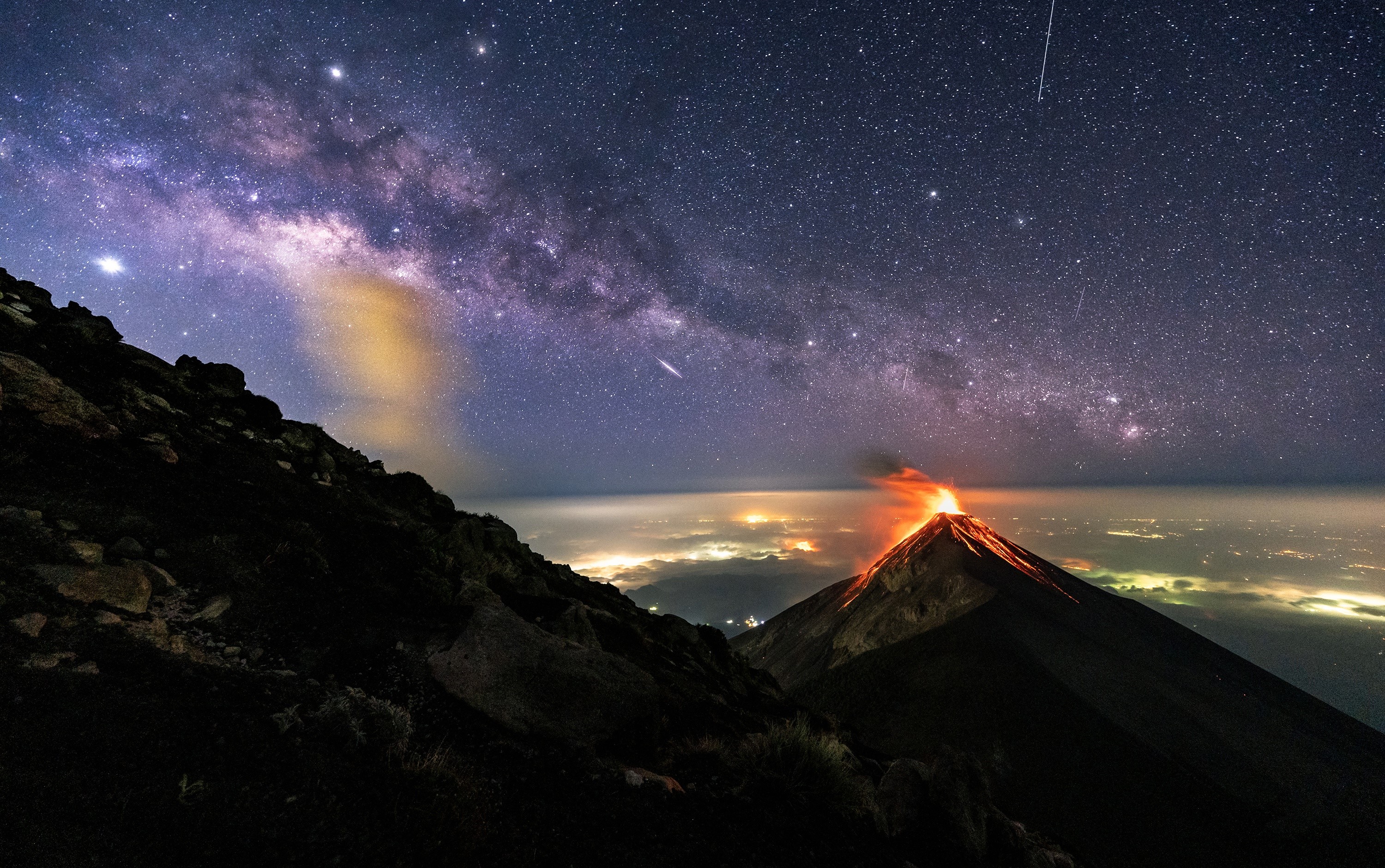 Volcano erupting under the Milky Way in Guatemala HD Wallpaper